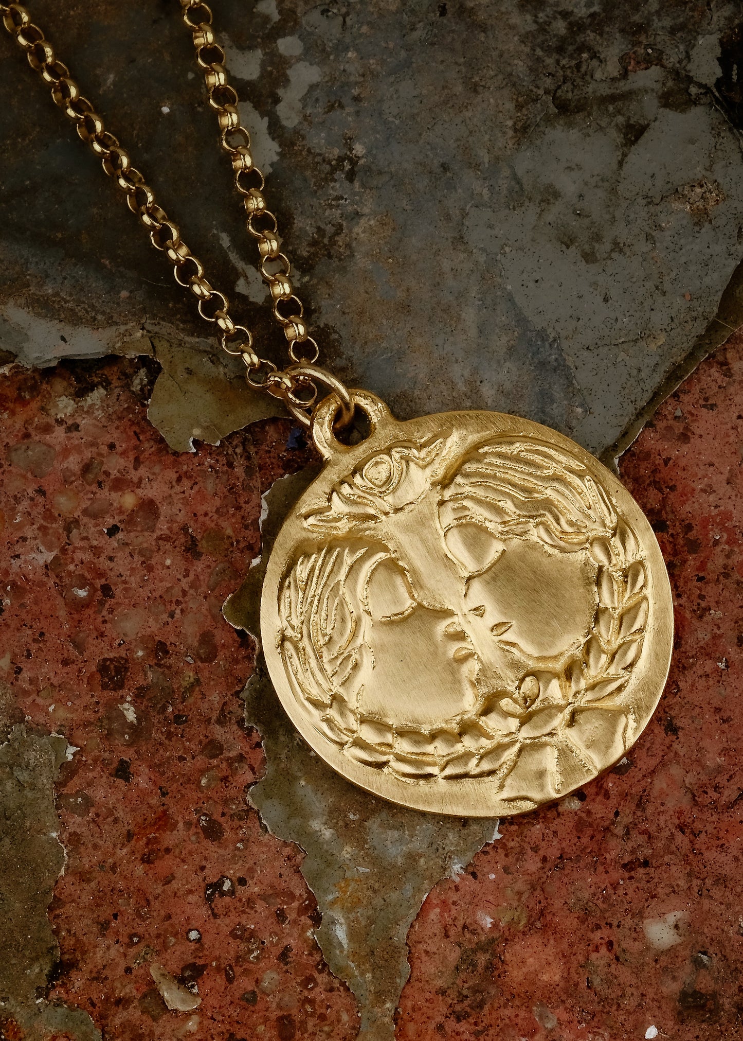 The third sign of the Zodiac, air sign Gemini is quick-witted and curious, with a dual personality that reflects an open mind. Hand-carved twins, bound together by a ribbon, grace this pendant—a necklace that captures the power of the celestial sky.