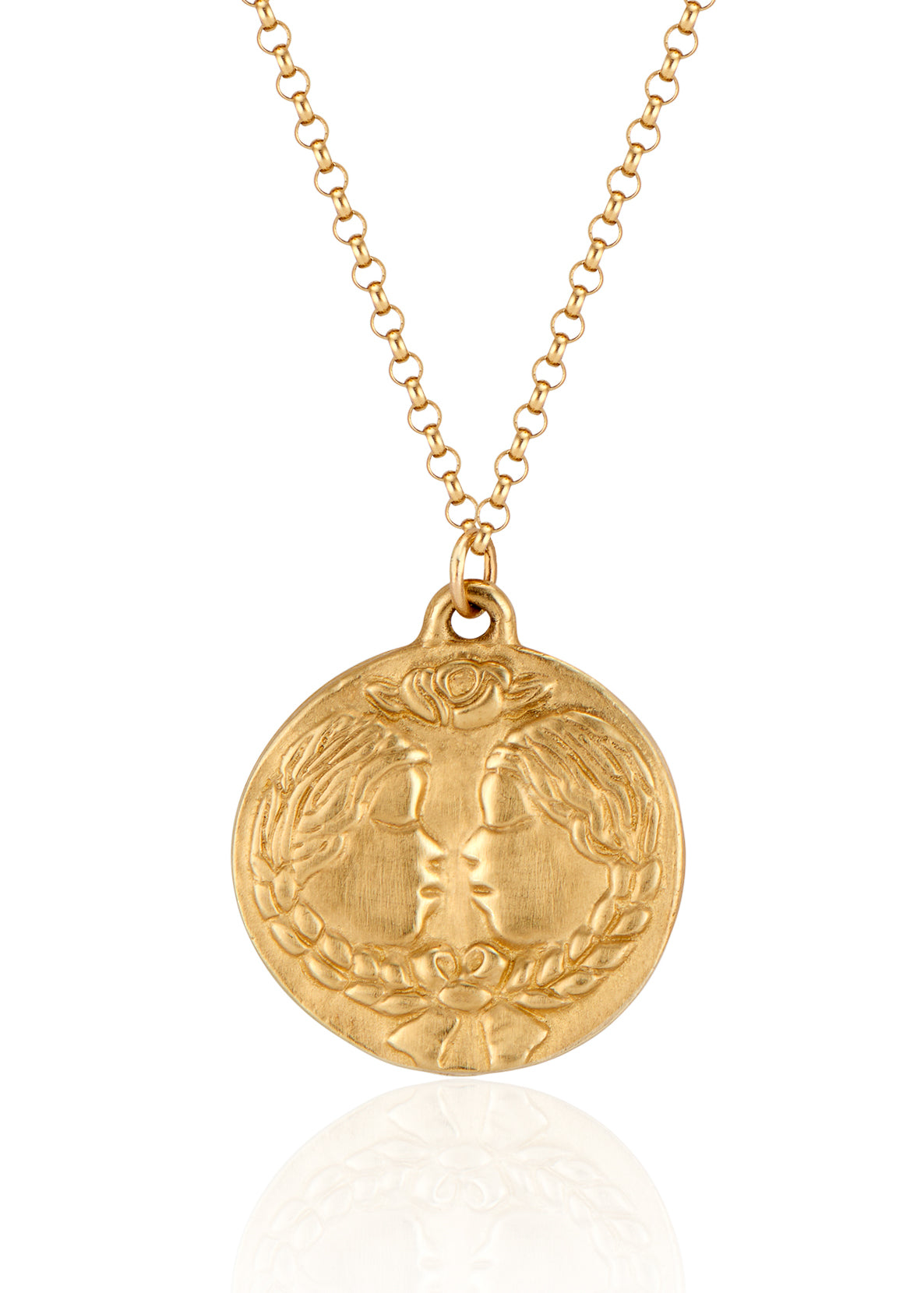The third sign of the Zodiac, air sign Gemini is quick-witted and curious, with a dual personality that reflects an open mind. Hand-carved twins, bound together by a ribbon, grace this pendant—a necklace that captures the power of the celestial sky.