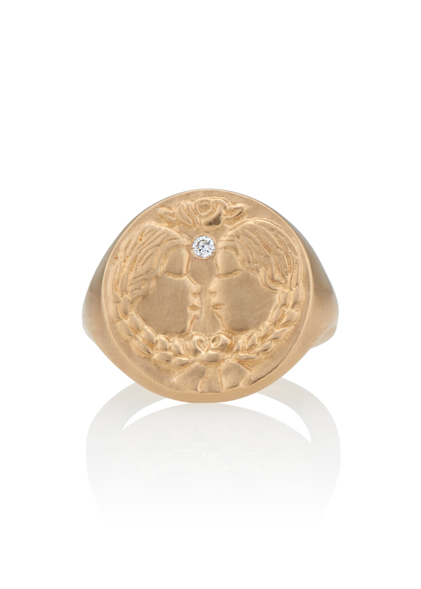 The third sign of the Zodiac, air sign Gemini is quick-witted and curious, with a dual personality that reflects an open mind. Hand-carved twins bound together by a ribbon are accented with a precious diamond for a ring that captures the power of the celestial sky.
