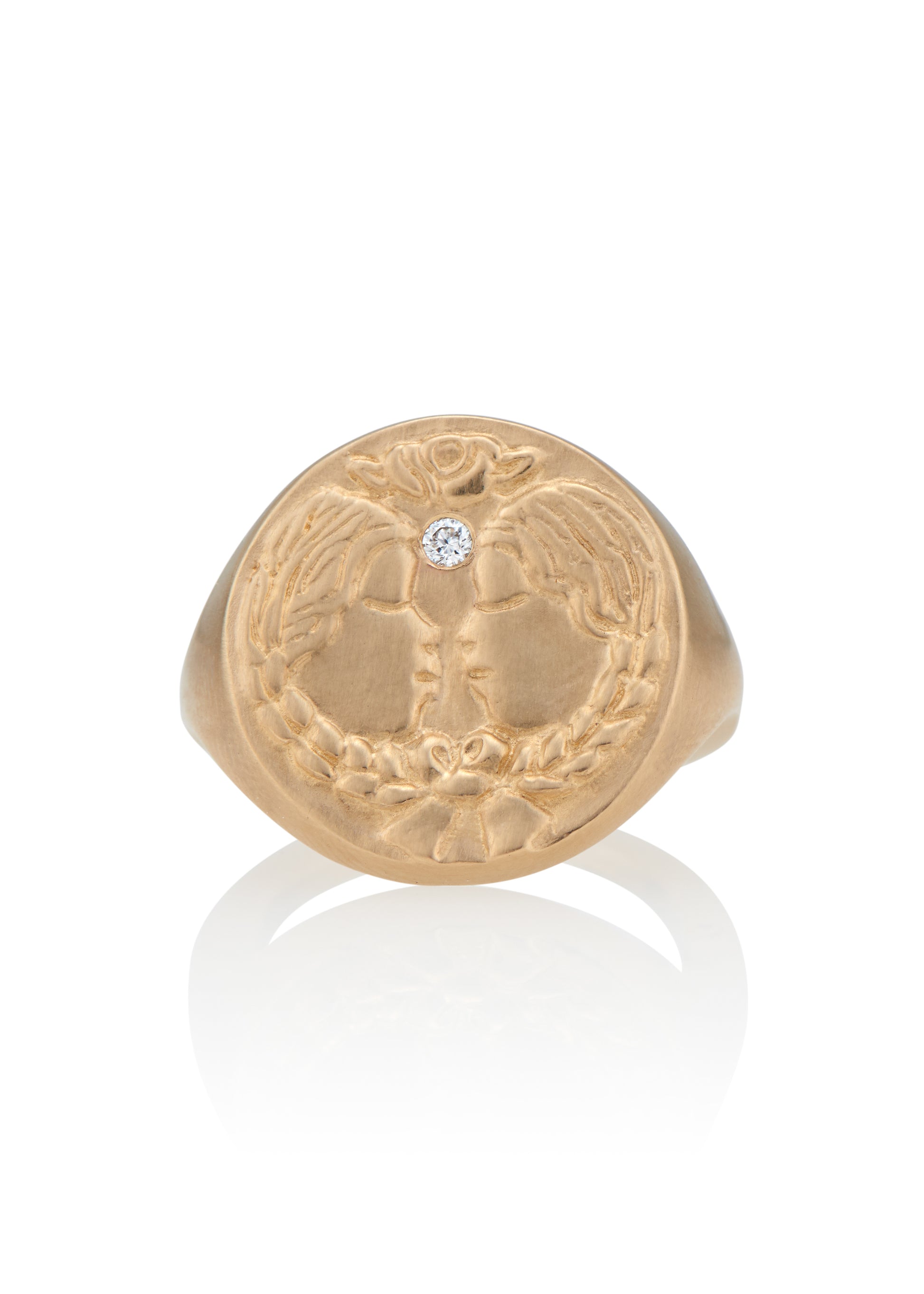 The third sign of the Zodiac, air sign Gemini is quick-witted and curious, with a dual personality that reflects an open mind. Hand-carved twins bound together by a ribbon are accented with a precious diamond for a ring that captures the power of the celestial sky.