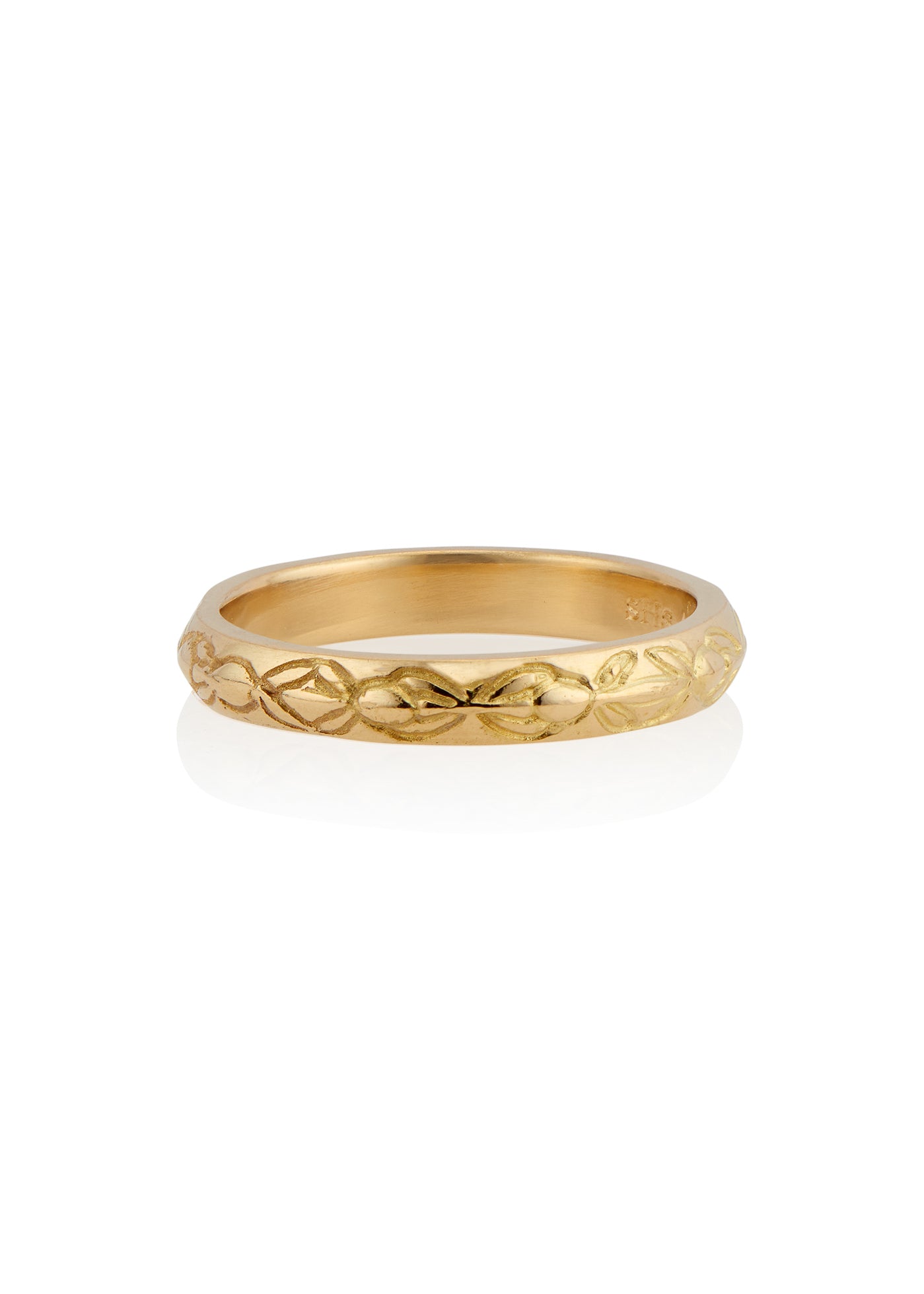 Inspired by the Aramiac word for “twin,” the Tomi ring was originally designed for a customer who requested two bands that shared deep similarities, yet claimed their own unique beauty. Hand-carved beads are connected with gently sloping lines, creating a pattern reminiscent of a delicate chain of flowers.