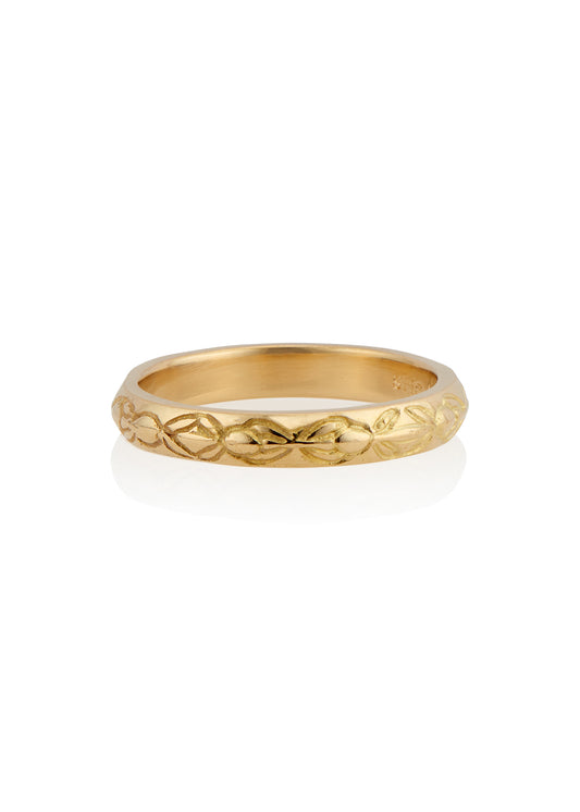 Inspired by the Aramiac word for “twin,” the Tomi ring was originally designed for a customer who requested two bands that shared deep similarities, yet claimed their own unique beauty. Hand-carved beads are connected with gently sloping lines, creating a pattern reminiscent of a delicate chain of flowers.