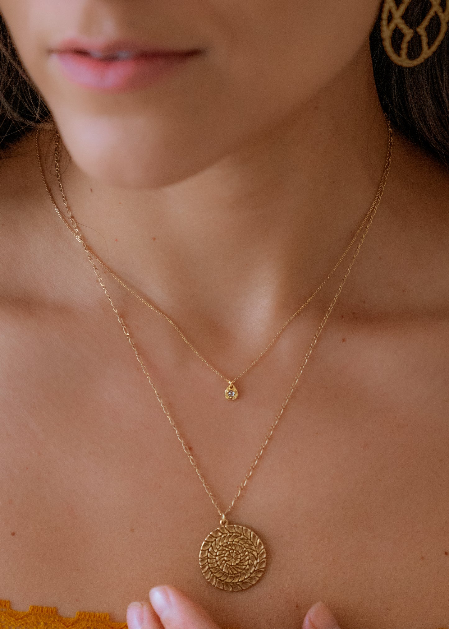 A romantic journey that transcends time. The Drop necklace merges a circle of understated hand-carved gold beads with ornate rose cut diamonds for a dangling romantic style that feels as at home today as it does in an antique jewelry box.