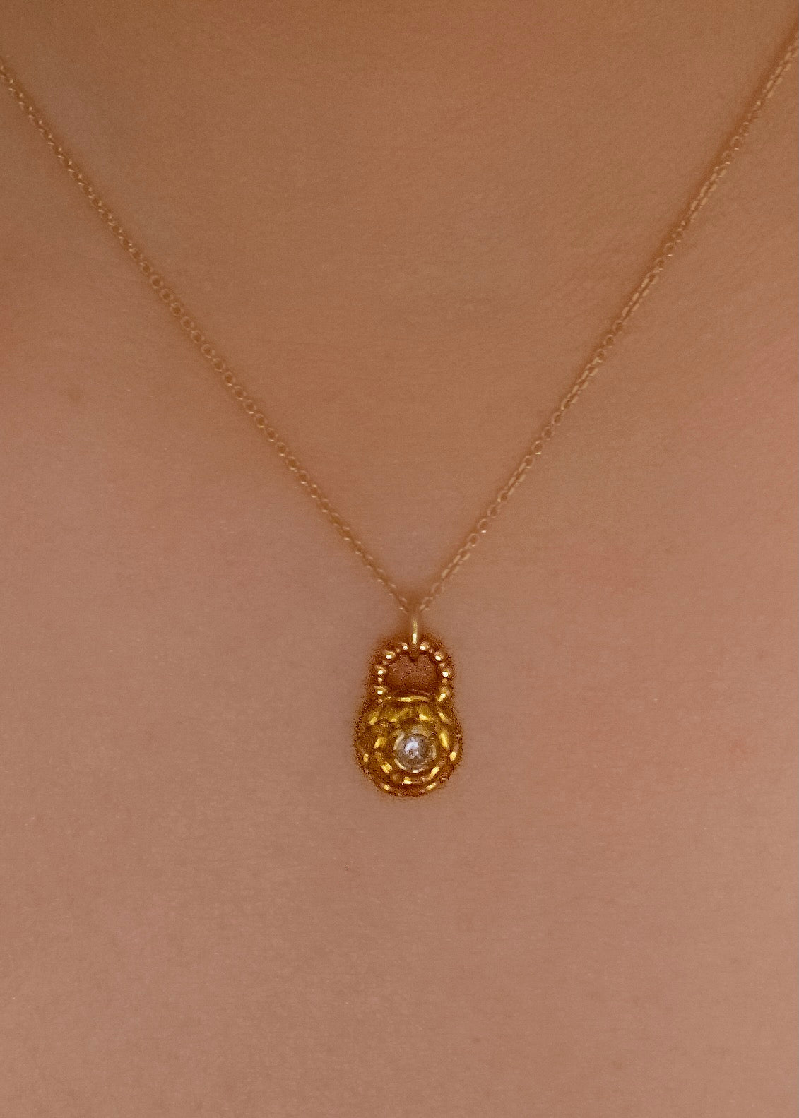 Featuring intricate hand-carved beads that center around a brilliant rose cut diamond, the Marquis necklace is fit for royalty and reimagined for everyday wear.