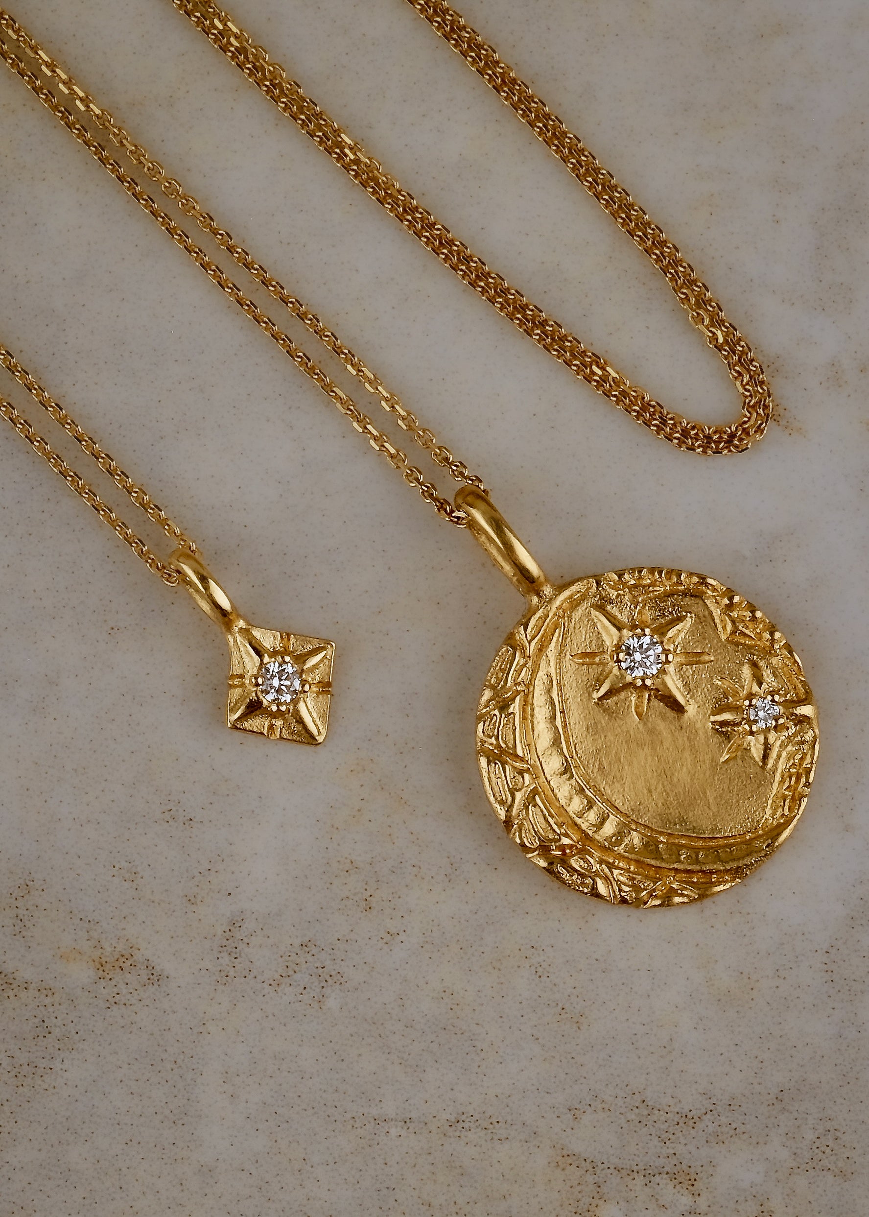 Cheers to the night owls. To the tender souls who create magic in the dark, who carry the secrets of the stars. The Night Owl is a gold pendant necklace that shines with a delicate, hand-textured crescent moon that cradles two diamond stars–an homage to an eternal love that exists beyond boundaries of space and time.