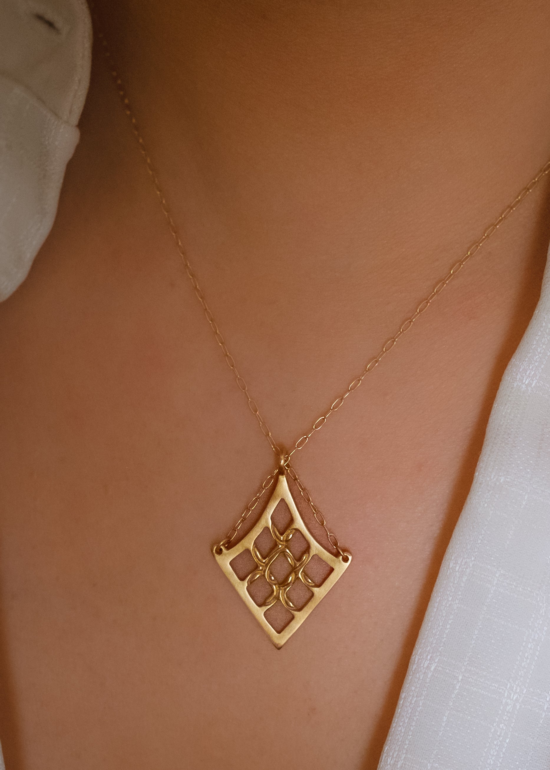 As formidable as the princess for which it is named. With its detailed gold lattice work, the Petite Shera necklace is a smaller version of the Shera necklace. A balance of delicate, bold and eye-catching, this is an empowering piece that makes a statement.