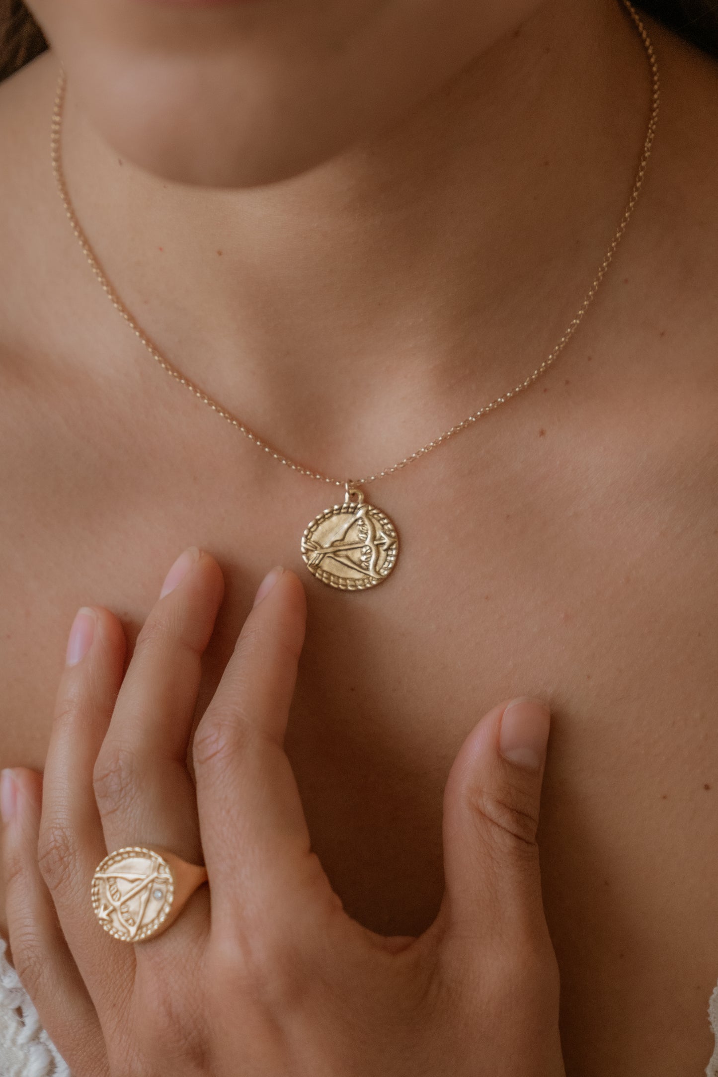 The ninth sign of the Zodiac, fire sign Sagittarius is a passionate traveler whose natural curiosity ignites their adventures. A hand-carved bow and arrow graces this pendant for a necklace that captures the power of the celestial sky.