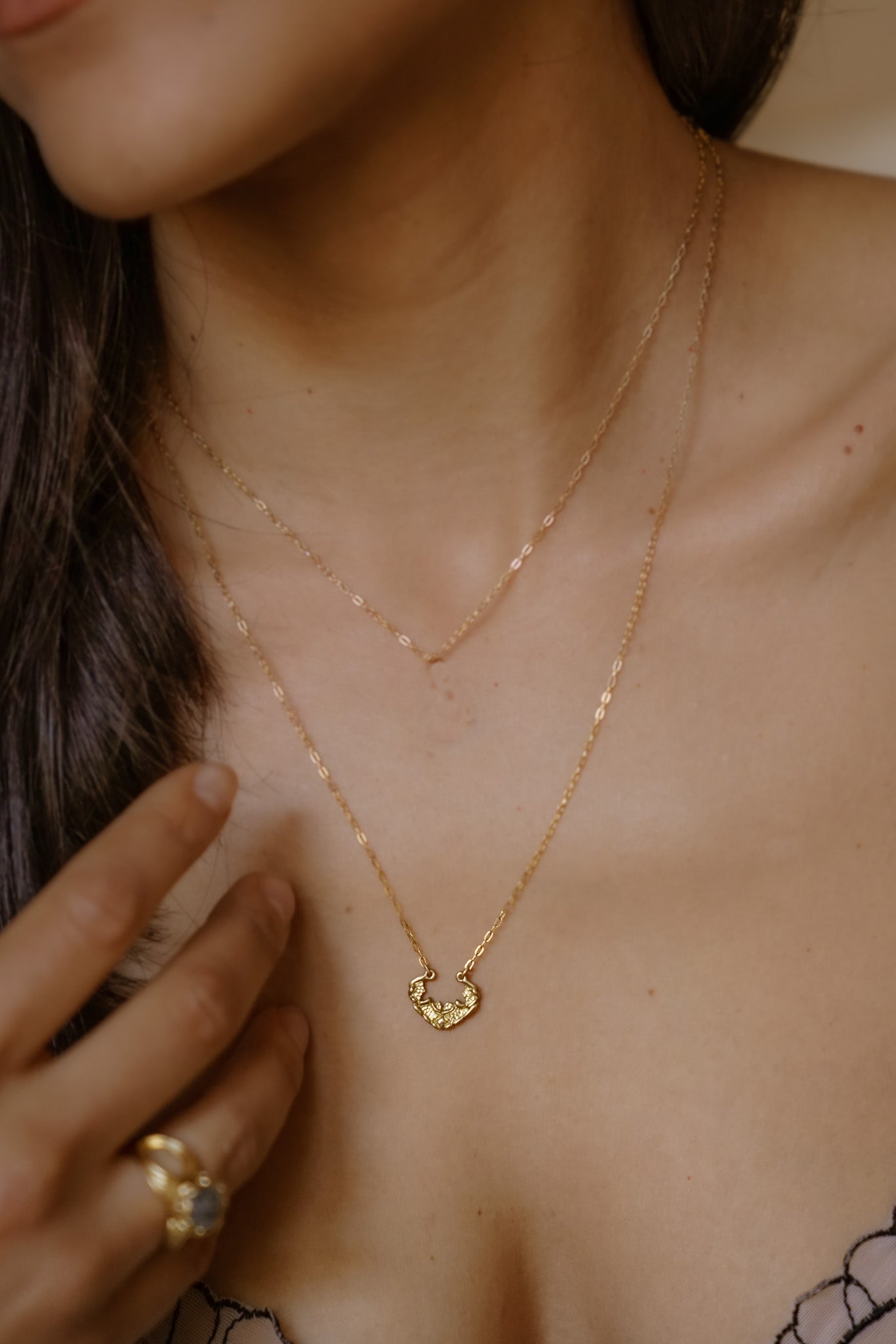 Named for the goddess of the sea, the Sedna necklace mirrors the undulating rhythm of the ocean. Gold waves expand and recede, revealing detailed texture that invites the eye to linger—a piece evocative of infinite strength and power.