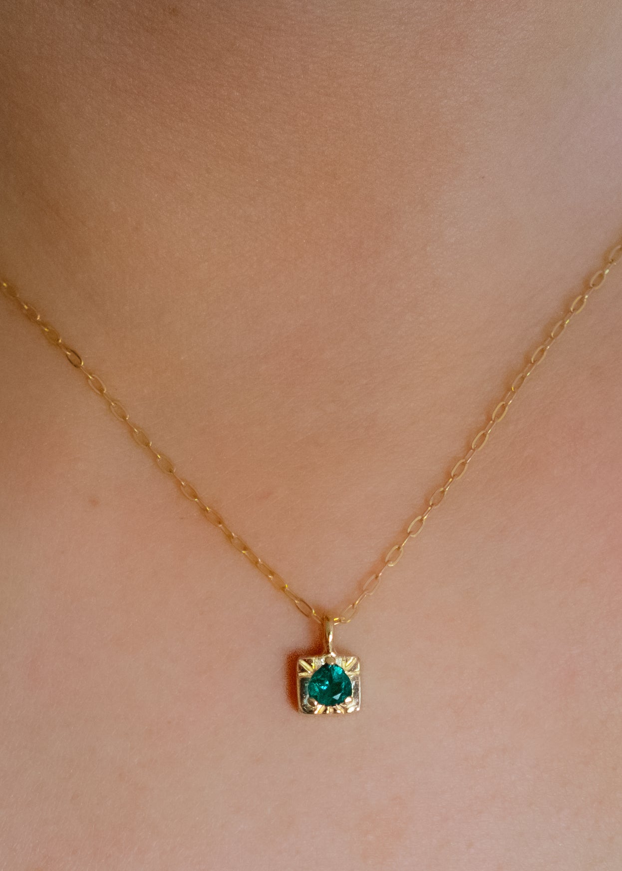 The fire of inspiration ignites with a single spark. Named after the Greek goddess of the hearth, the Vesta necklace features an engraved box-shaped gold charm with a tourmaline stone that glimmers like sacred embers–a piece that glows with promise and warmth.