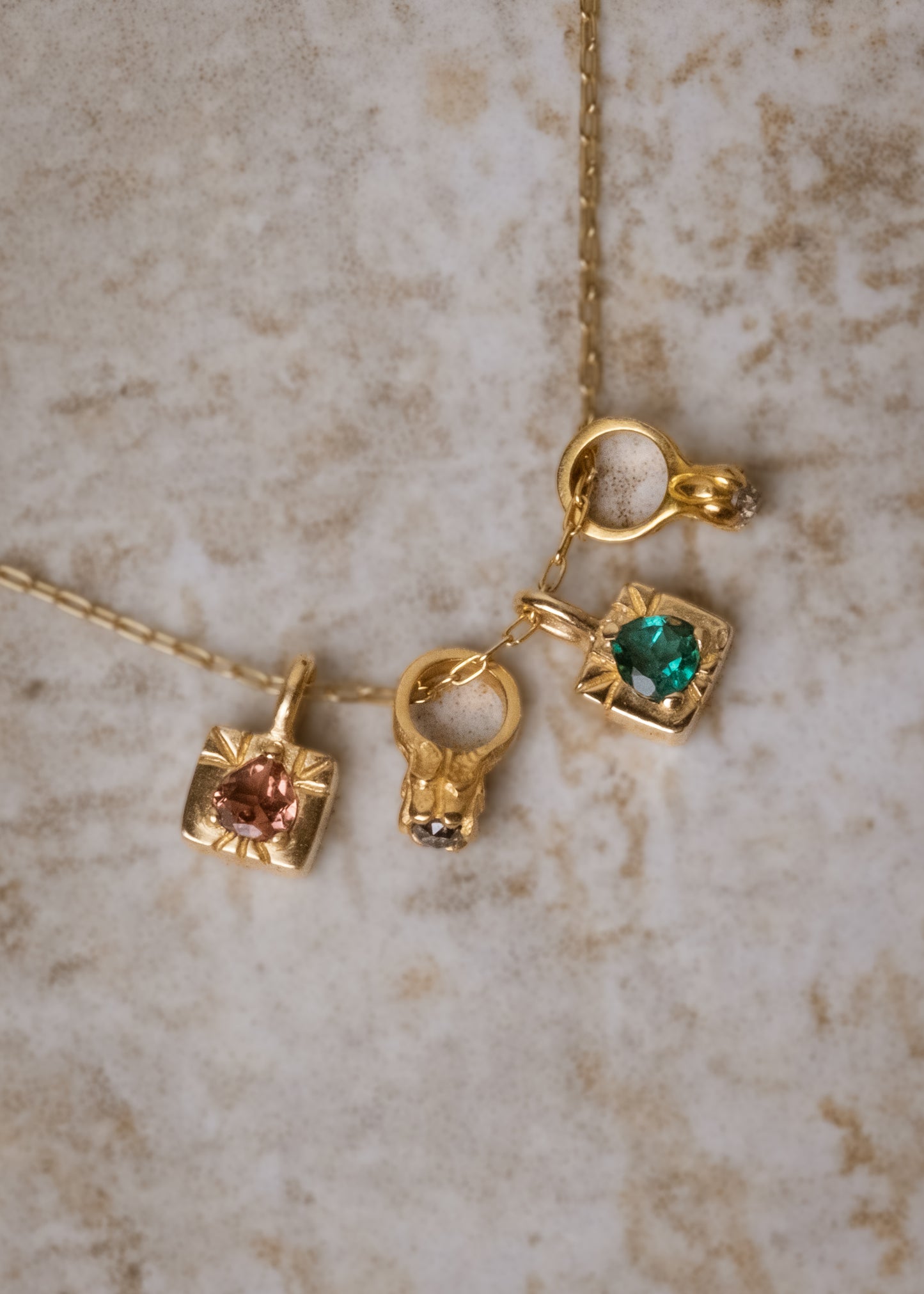 The fire of inspiration ignites with a single spark. Named after the Greek goddess of the hearth, the Vesta necklace features an engraved box-shaped gold charm with a tourmaline stone that glimmers like sacred embers–a piece that glows with promise and warmth.