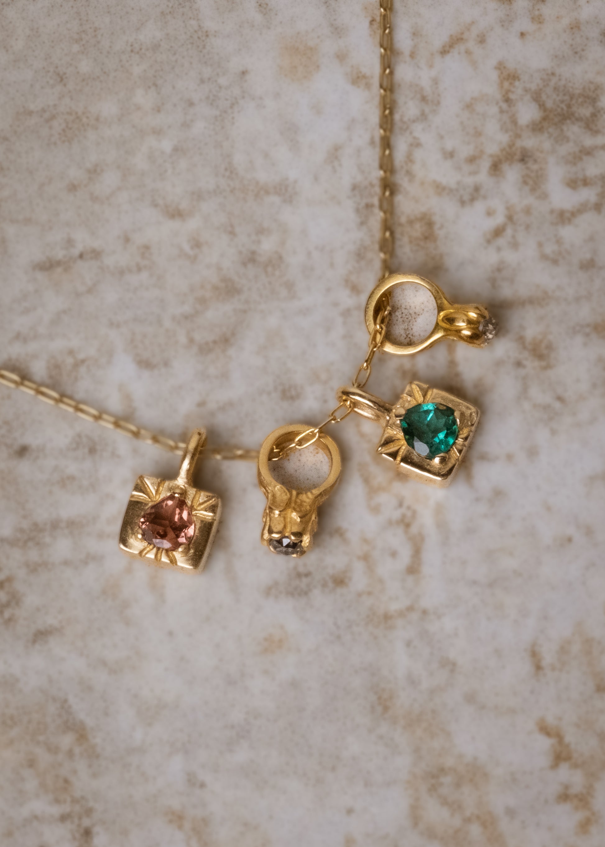 The fire of inspiration ignites with a single spark. Named after the Greek goddess of the hearth, the Vesta necklace features an engraved box-shaped gold charm with a tourmaline stone that glimmers like sacred embers–a piece that glows with promise and warmth.