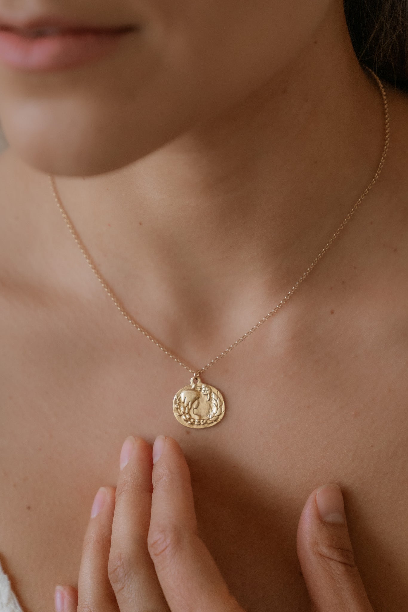 The sixth sign of the Zodiac, Earth sign Virgo is a tender humanitarian of strong character with an unparalleled eye for detail. A hand-carved goddess—surrounded by flowers and wearing a braid that turns into a sheaf— creates a necklace that captures the power of the celestial sky.