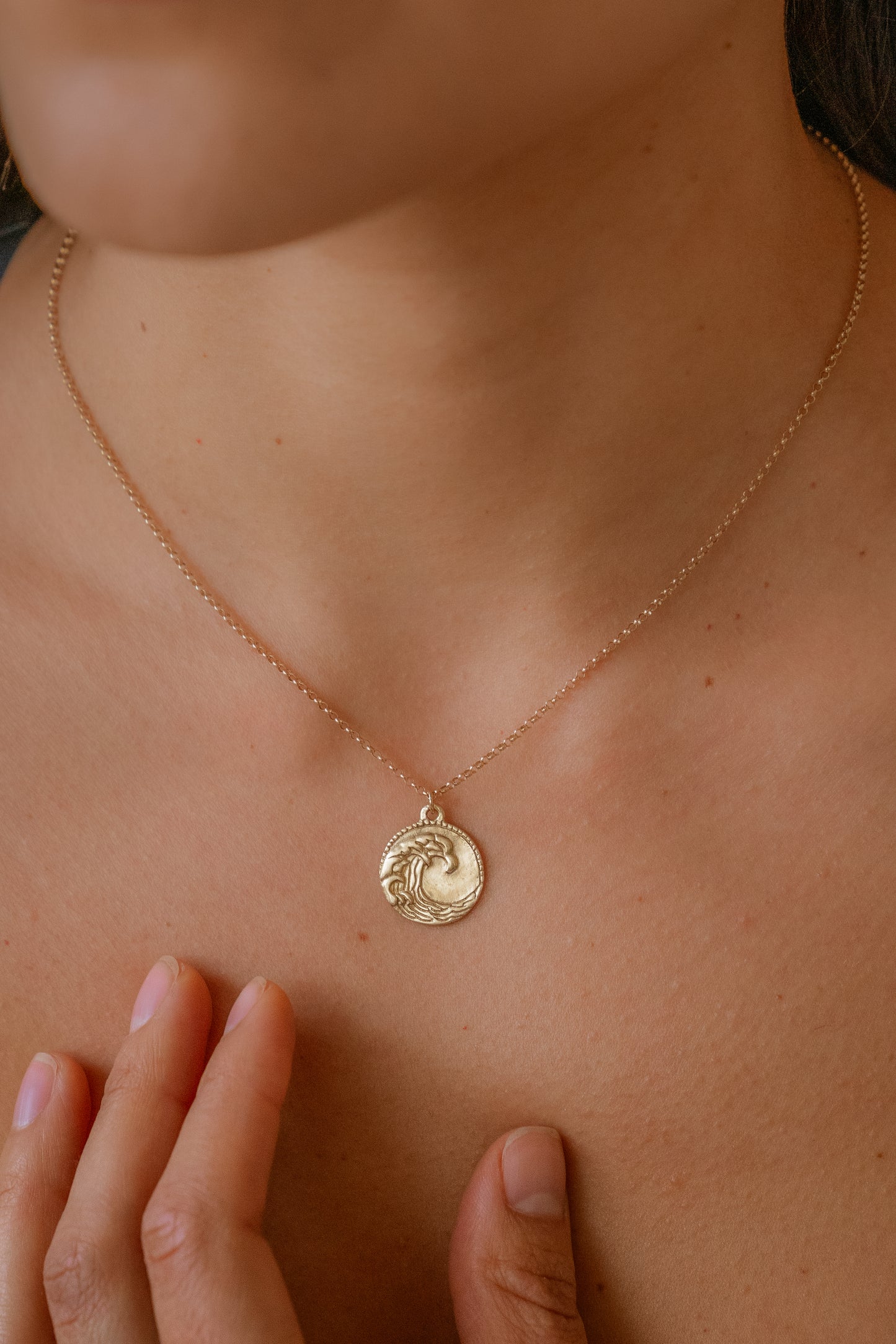 The eleventh sign of the Zodiac, air sign Aquarius is a deep thinker who wants to change the world. A hand-carved wave graces this pendant for a necklace that captures the power of the celestial sky.