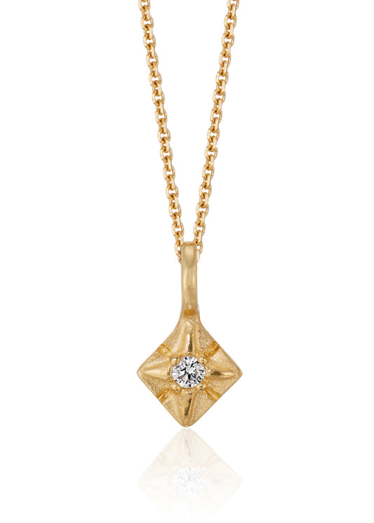 Through the sharp peak of a dormer window, a single star catches the eye: At the apex of the constellation it shines, as if hung by the starmaiden Astrea herself. Named for the Greek goddess, the Astrea necklace features a brilliant diamond that nestles between the zenith and nadir of a golden horizon. Hand-carved detail surrounding the diamond enhances its brilliance.