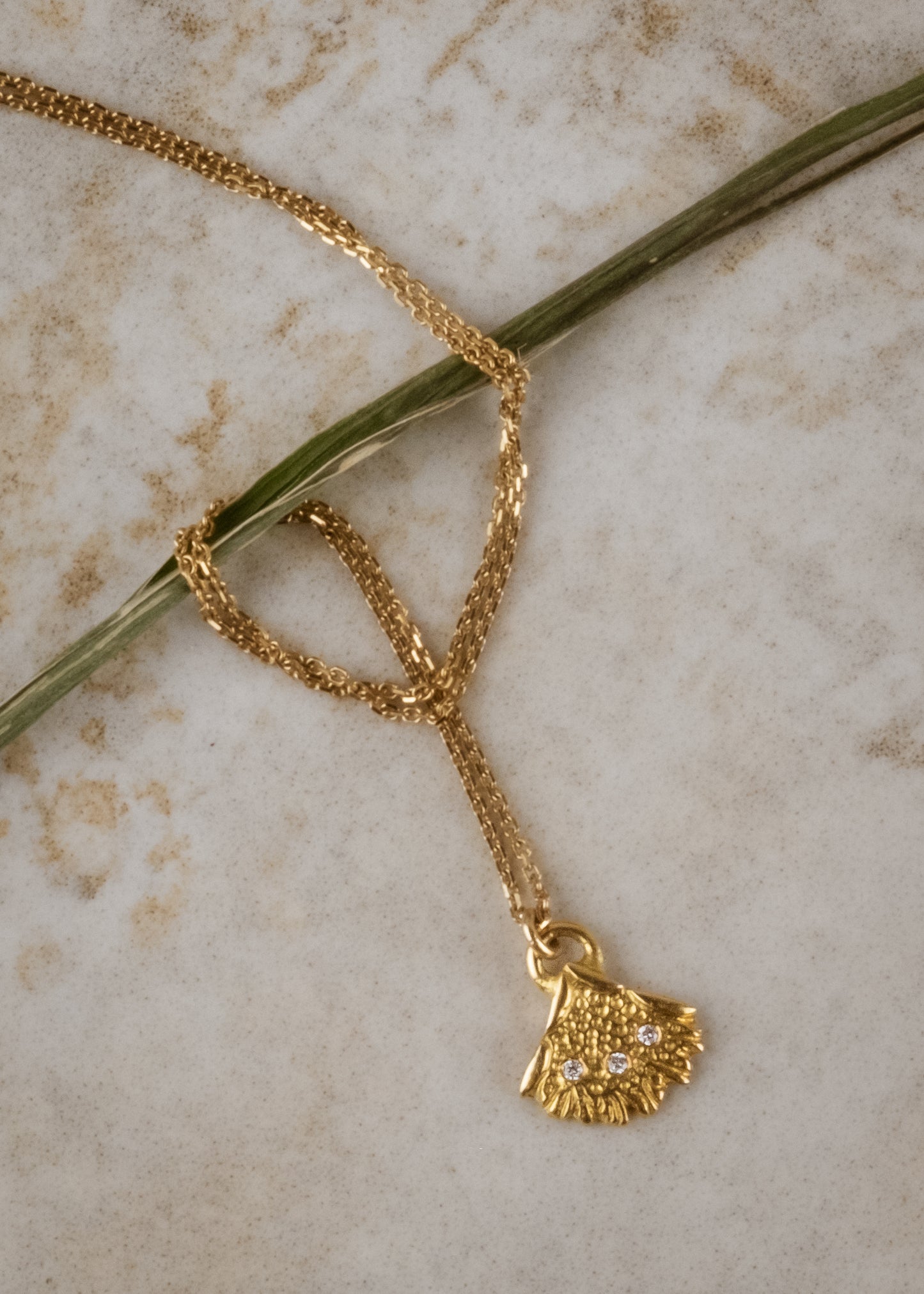 Inspired by antique folding fans of the same name, the Brise necklace is a study in craftsmanship. Three gleaming diamonds grace elaborate scales that fan out to intricate lace-like edging, creating an ornate and elegant piece to be cherished for generations.
