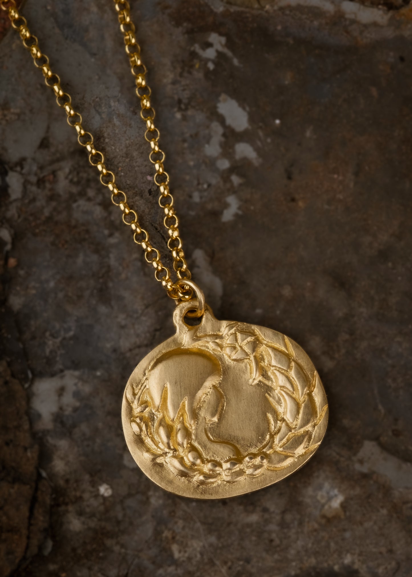 The sixth sign of the Zodiac, Earth sign Virgo is a tender humanitarian of strong character with an unparalleled eye for detail. A hand-carved goddess—surrounded by flowers and wearing a braid that turns into a sheaf— creates a necklace that captures the power of the celestial sky.