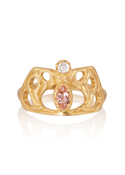 Framed by an intricate open-work pattern, the Anthea ring imagines the Greek goddess rendered in a window of stained glass, cradled by serpentine mullions of gleaming gold. A stunning tourmaline stone and rose cut diamond create a sensuous silhouette on this ring that bears her name.
