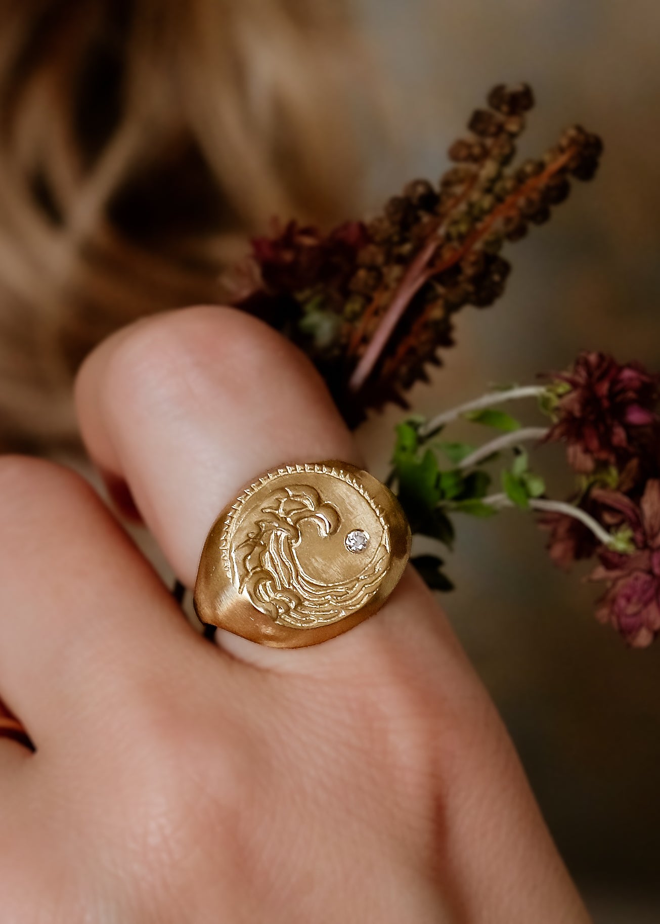 The eleventh sign of the Zodiac, air sign Aquarius is a deep thinker who wants to change the world. A hand-carved wave graces this pendant for a necklace that captures the power of the celestial sky.