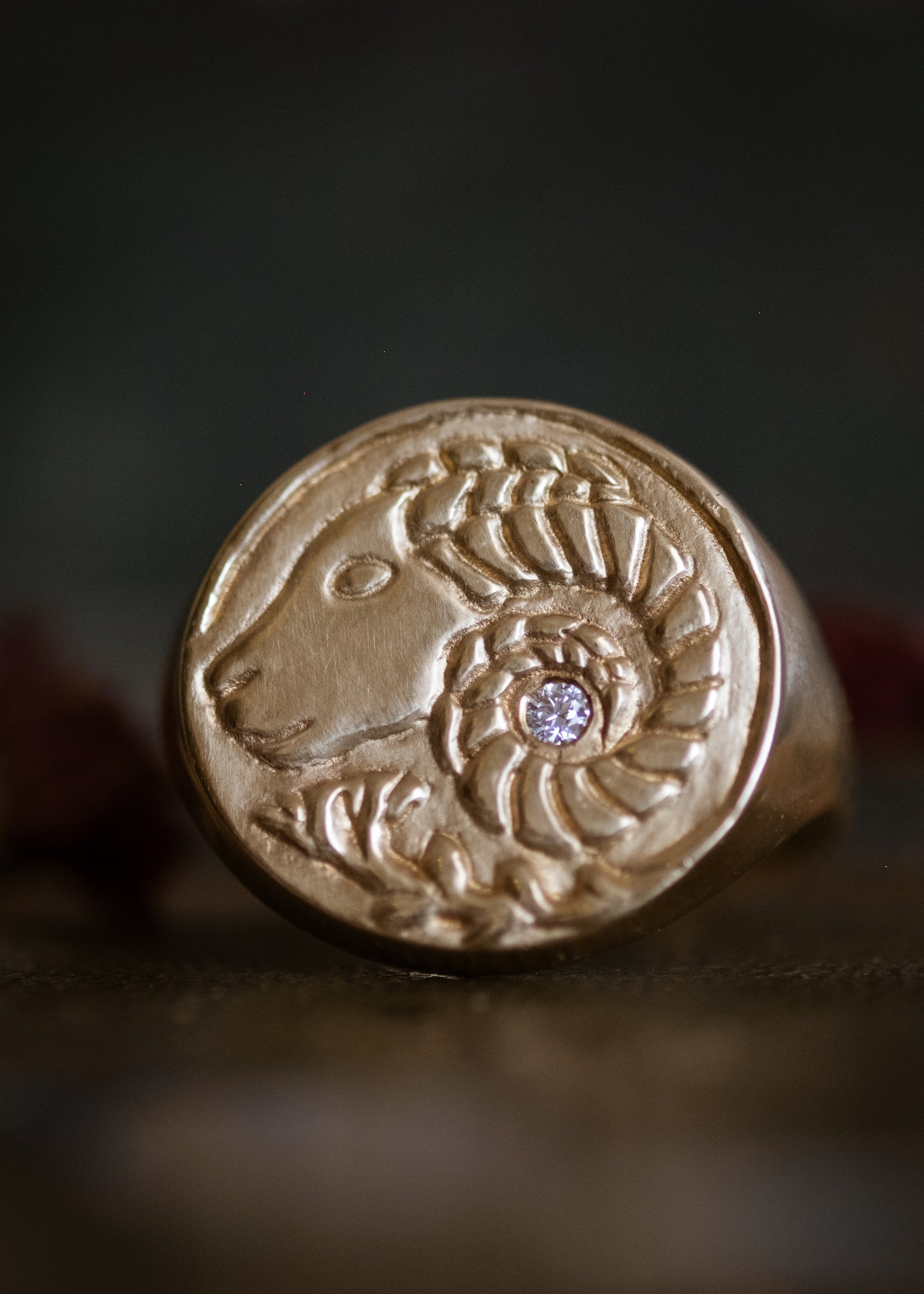 The first sign of the Zodiac, fire sign Aries harkens new beginnings and embodies action. A hand-carved Ram, dignified and strong, graces this pendant—a necklace that captures the power of the celestial sky.