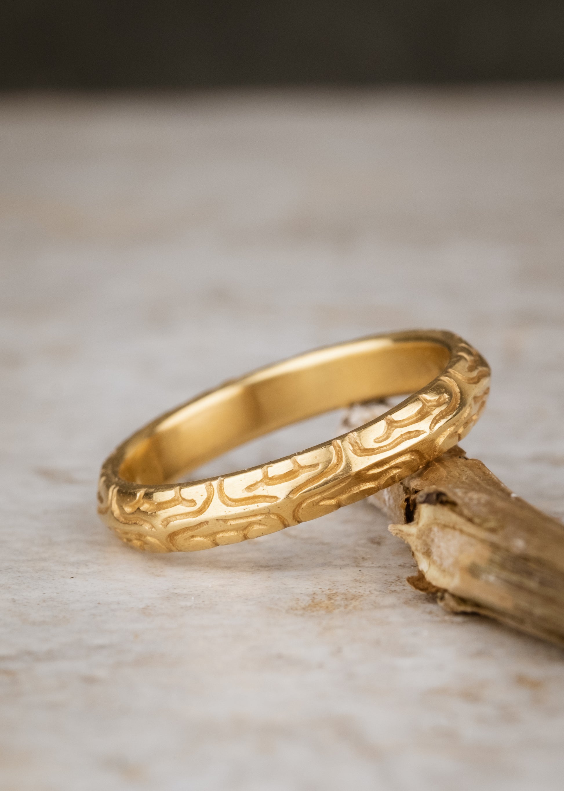 Inspired by the Aramiac word for “twin,” the Mina ring was originally designed for a customer who requested two bands that shared deep similarities, yet claimed their own unique beauty. Delicate lines gently advance and retreat, creating an intricate, detailed pattern.
