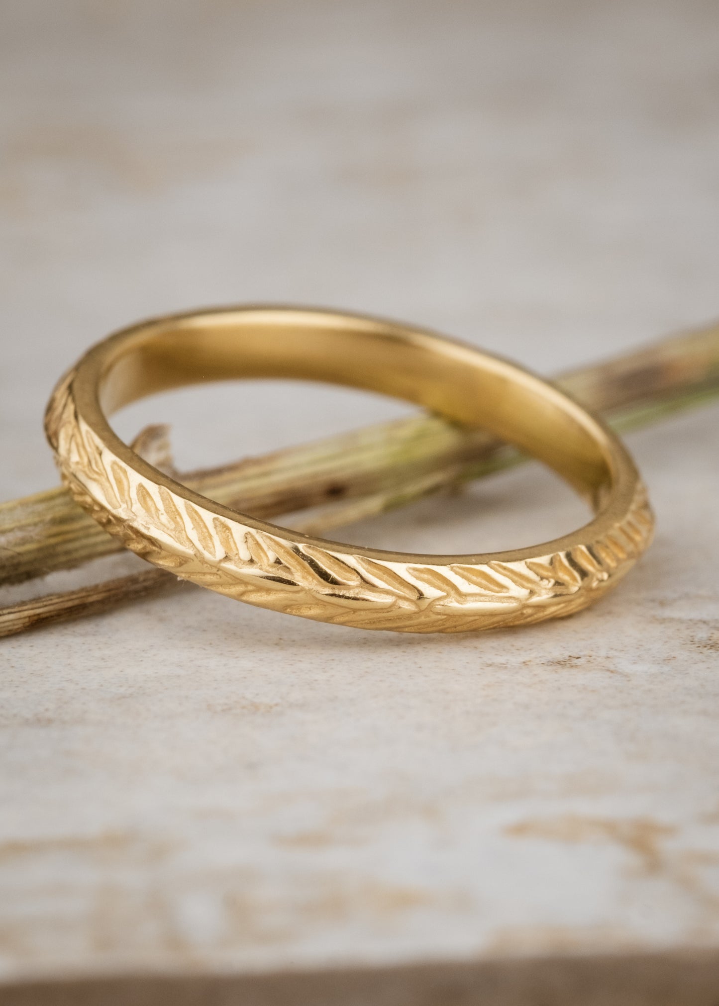 Named for a woman of strength, the Thia ring is detailed with elongated beads balanced on either side by simple v-shaped etchings that mimic a feather—weightless, yet capable of unimaginable feats.