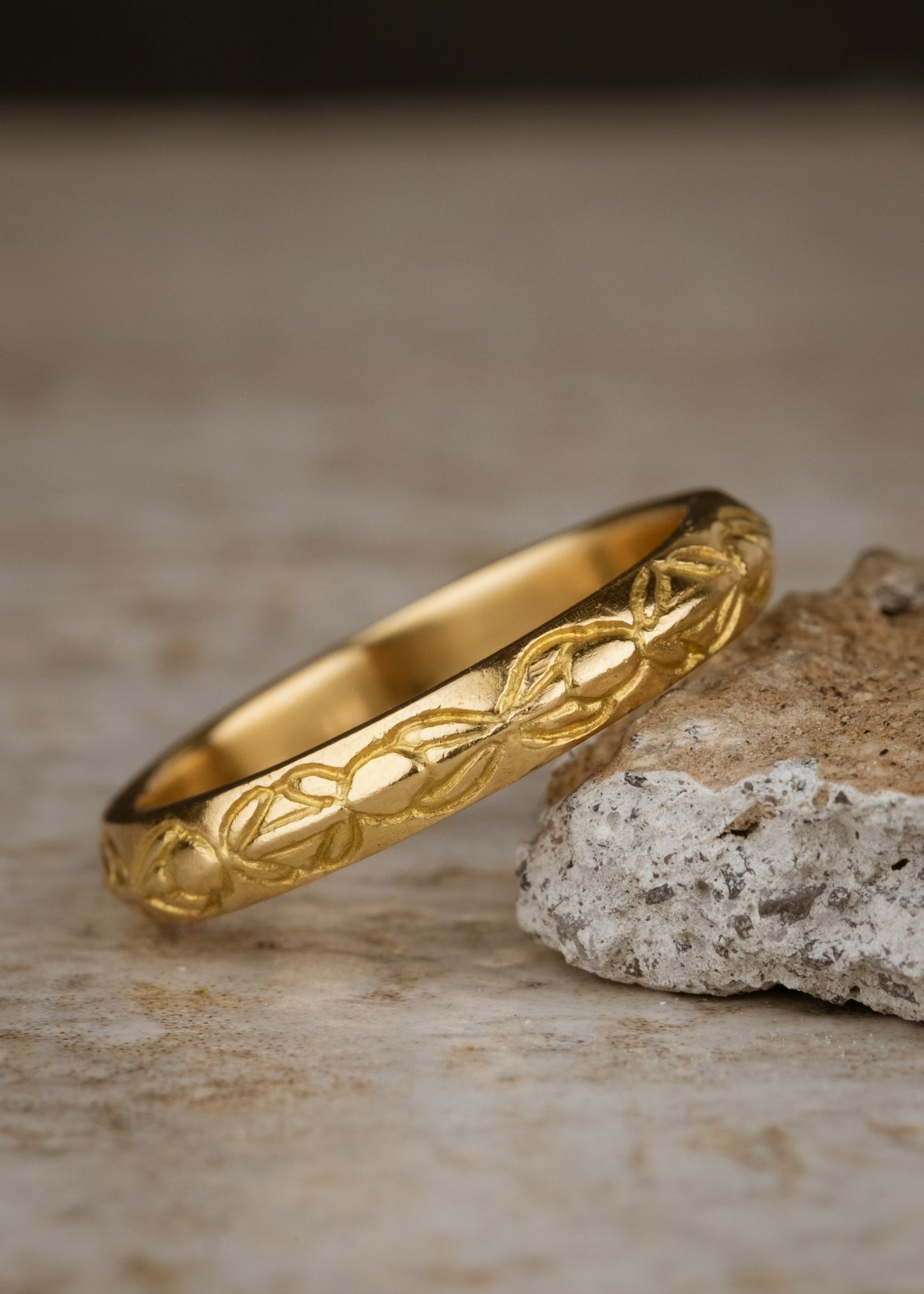 Inspired by the Aramiac word for “twin,” the Tomi ring was originally designed for a customer who requested two bands that shared deep similarities, yet claimed their own unique beauty. Hand-carved beads are connected with gently sloping lines, creating a pattern reminiscent of a delicate chain of flowers.