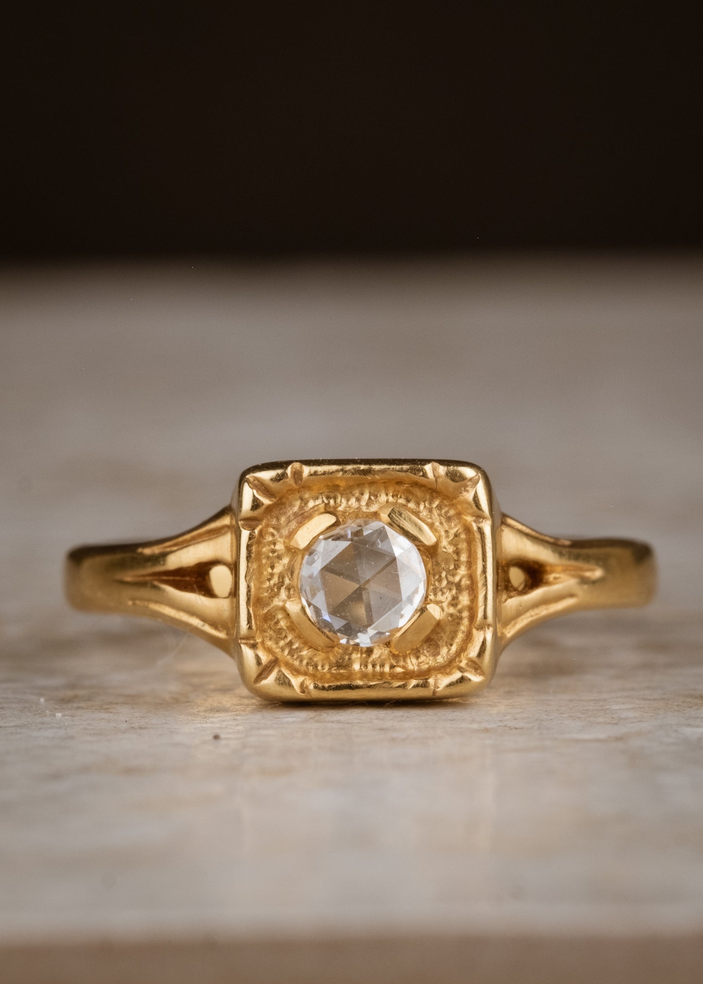 Modern lines intersect with an antique aesthetic to create the Chamber ring, a square setting of textured gold that houses a recessed rose cut diamond— strong and substantial, a meaningful connection to the past and present.