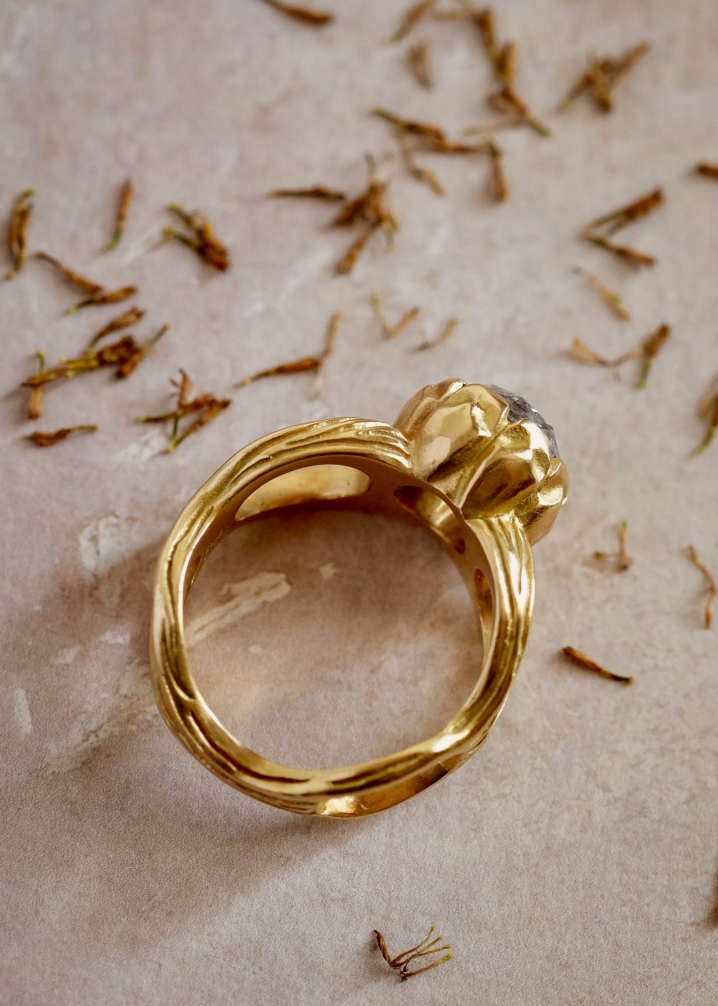 The ring that began a lifelong love affair with rose cut diamonds. With its hand-detailed gold band, the Crown ring sits loftily on the finger, its vertical prongs enveloping a brilliant rose cut diamond—truly, a piece that reigns supreme.