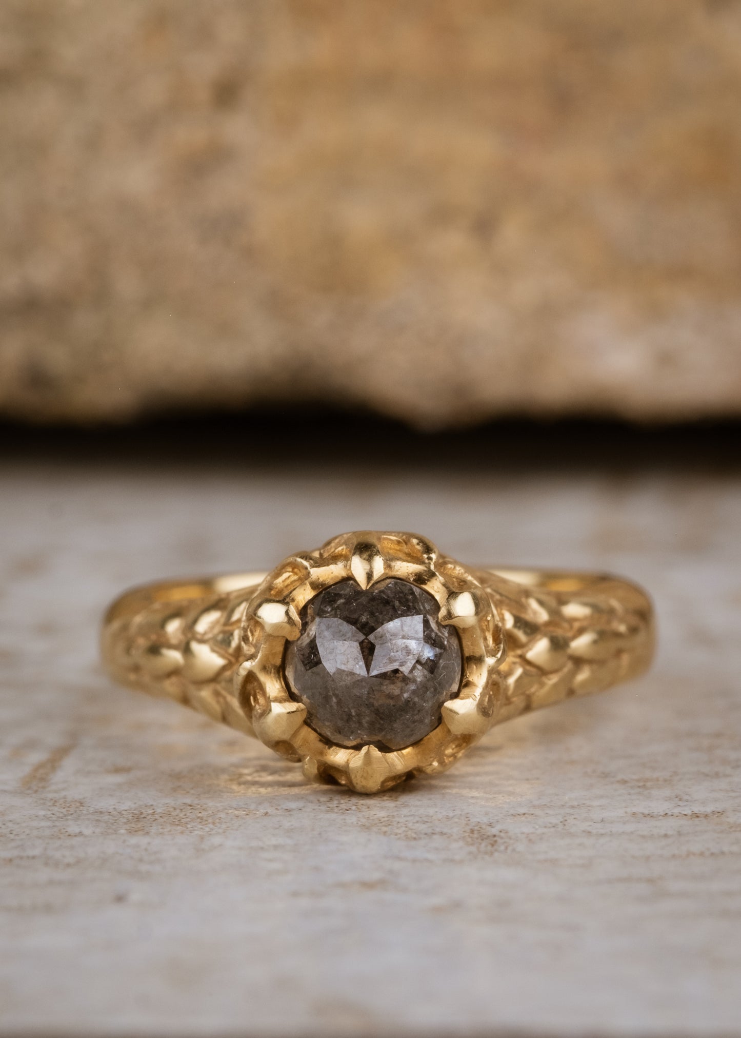 A celebration of craftsmanship, the Jubilee ring is hand-carved to bring out intricate elements in the band of gold, marrying substance with he supernal and revealing a rose cut diamond that mesmerizes with its depth and dimension.