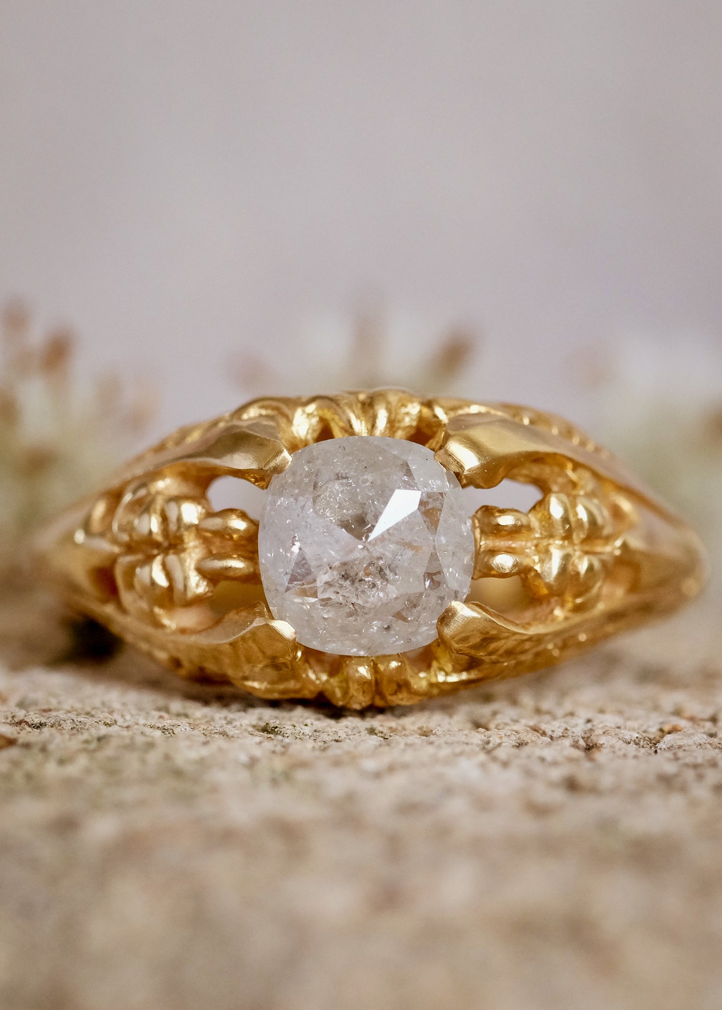 Capturing the ornate details of the Victorian era, the Violette ring was inspired by the love between Prince Albert and Queen Victoria. A substantial gold band is rich in intricate detail, showcasing craftsmanship with each bead, curve and open space. A stunning rose cut diamond sits flush among the prongs, creating a romantic ring to cherish for the ages.