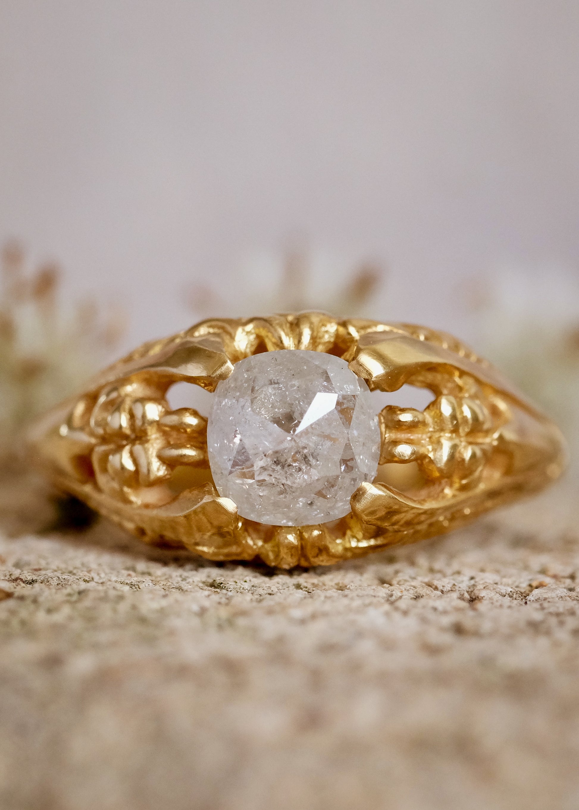 Capturing the ornate details of the Victorian era, the Violette ring was inspired by the love between Prince Albert and Queen Victoria. A substantial gold band is rich in intricate detail, showcasing craftsmanship with each bead, curve and open space. A stunning rose cut diamond sits flush among the prongs, creating a romantic ring to cherish for the ages.