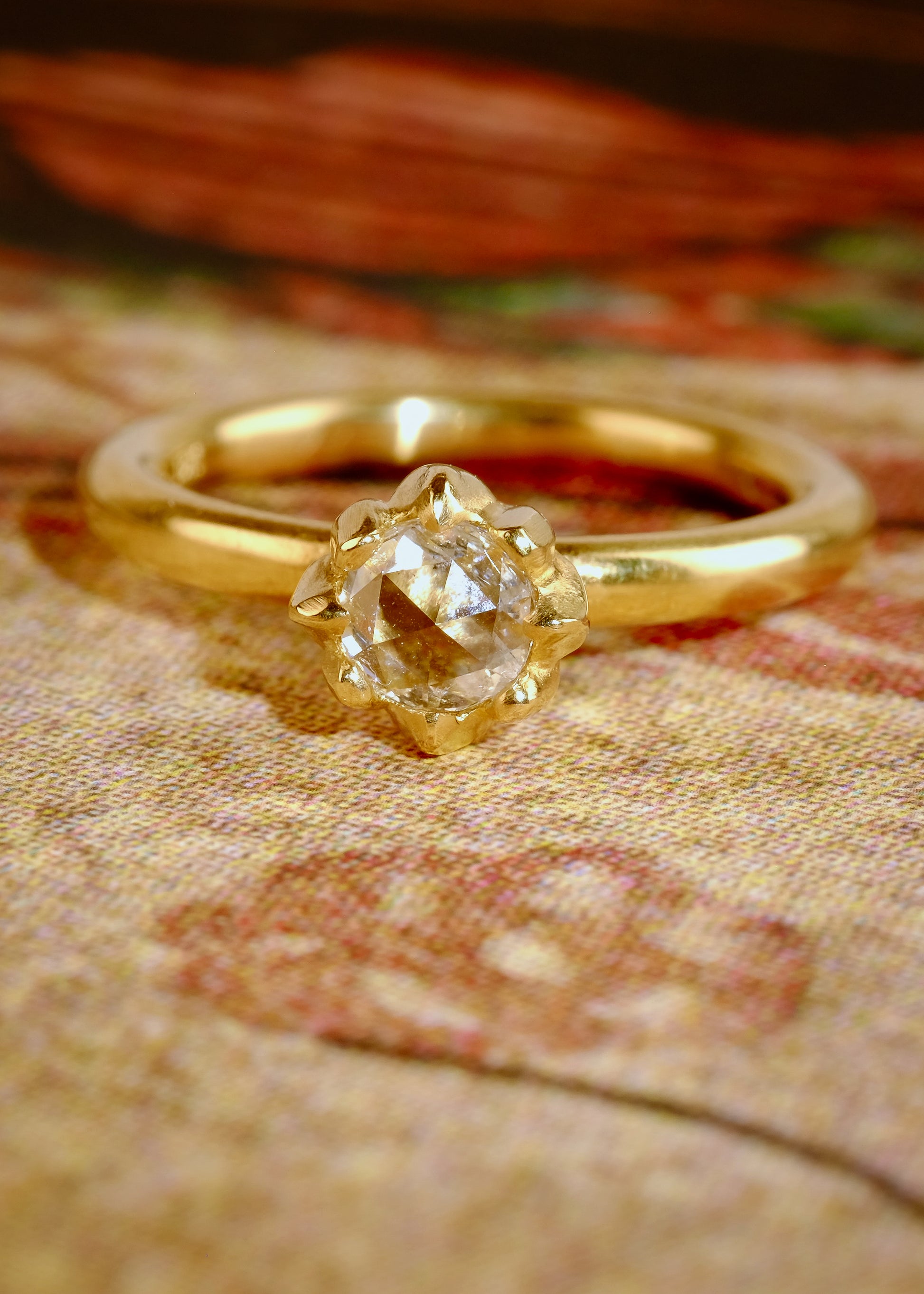 In simplicity, majesty is revealed. Inspired by the stark and graphic botanical photographs of Karl Blossfeldt, the Fleur ring creates a striking silhouette on the finger, its clean gold band showcasing a regal and romantic rose cut diamond.
