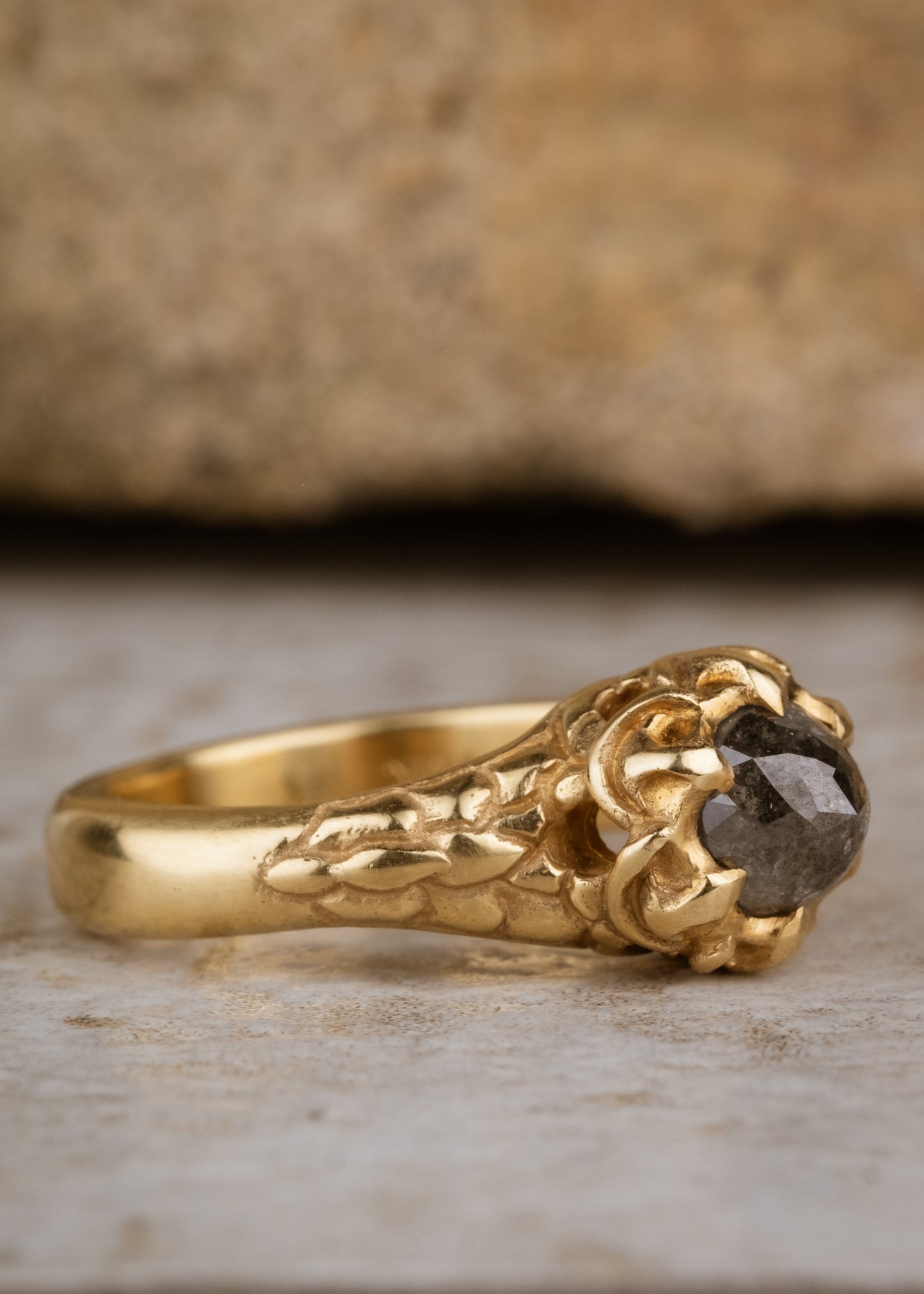 A celebration of craftsmanship, the Jubilee ring is hand-carved to bring out intricate elements in the band of gold, marrying substance with he supernal and revealing a rose cut diamond that mesmerizes with its depth and dimension.