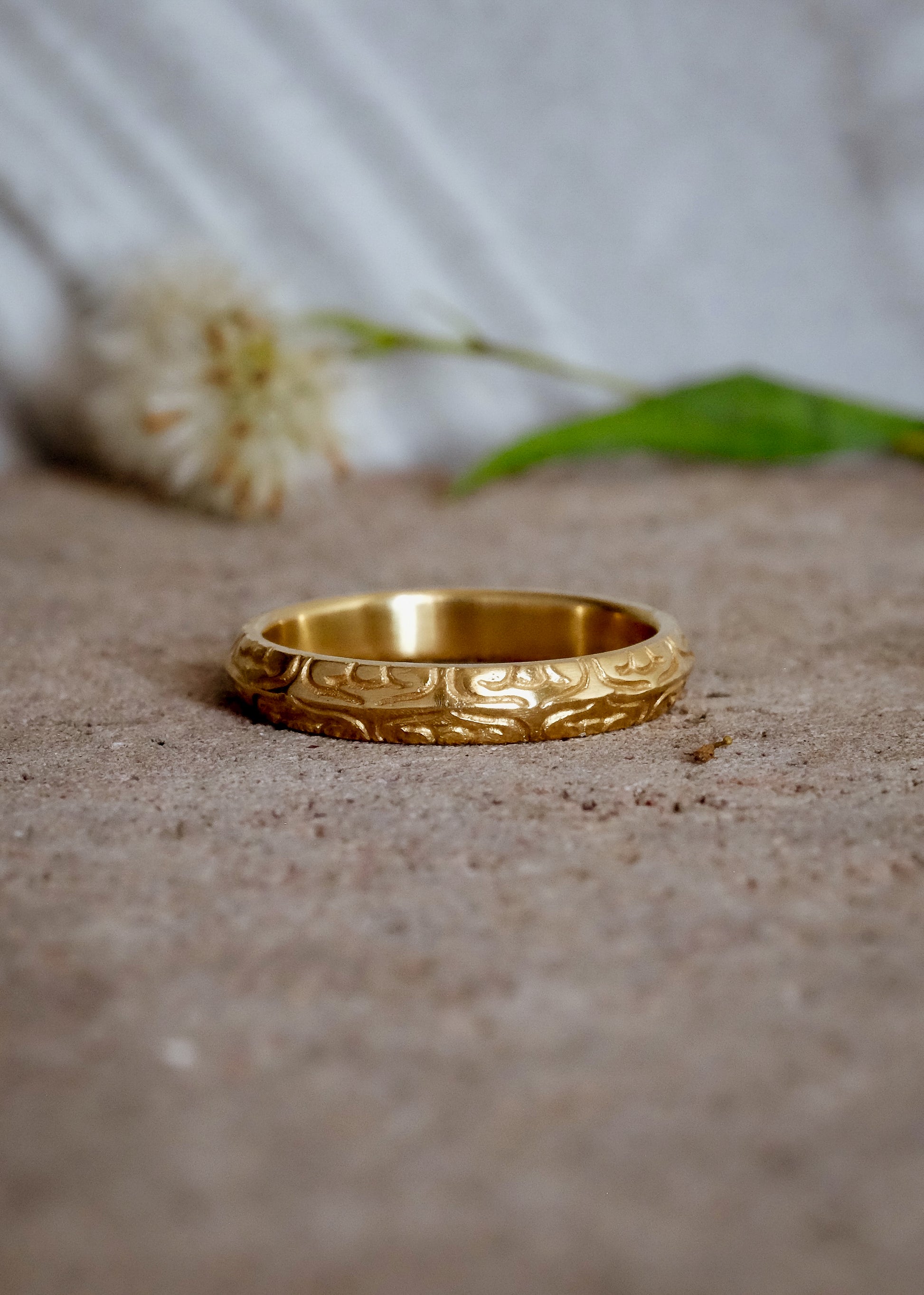 Inspired by the Aramiac word for “twin,” the Mina ring was originally designed for a customer who requested two bands that shared deep similarities, yet claimed their own unique beauty. Delicate lines gently advance and retreat, creating an intricate, detailed pattern.