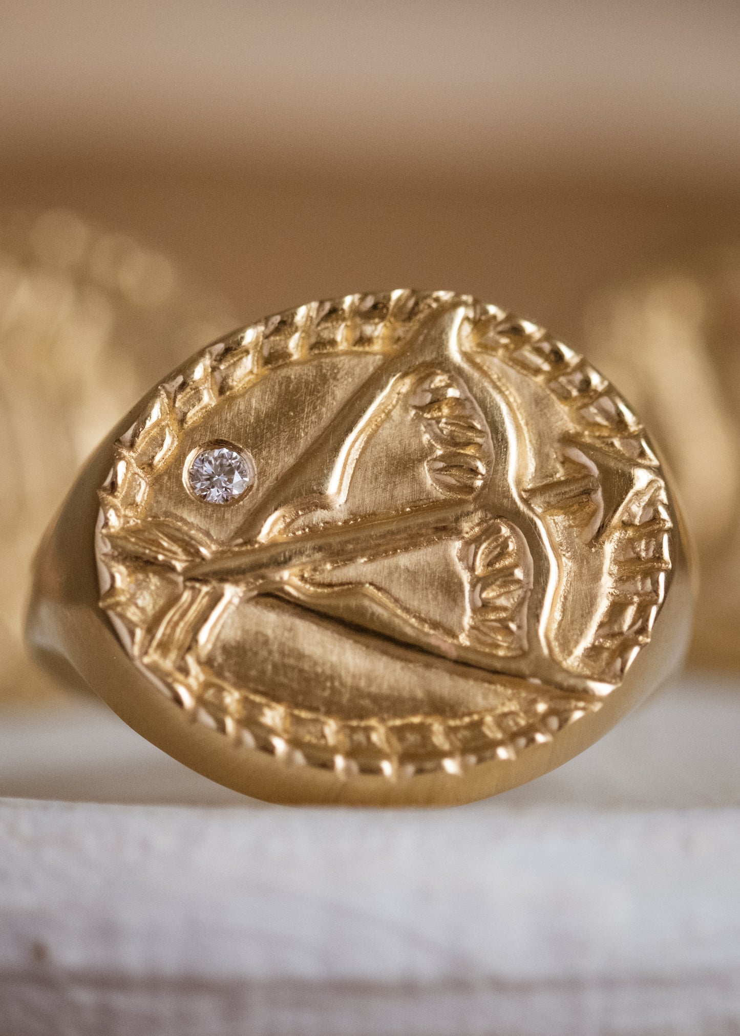The ninth sign of the Zodiac, fire sign Sagittarius is a passionate traveler whose natural curiosity ignites their adventures. A hand-detailed bow and arrow is accented with a precious diamond for a ring that captures the power of the celestial sky.