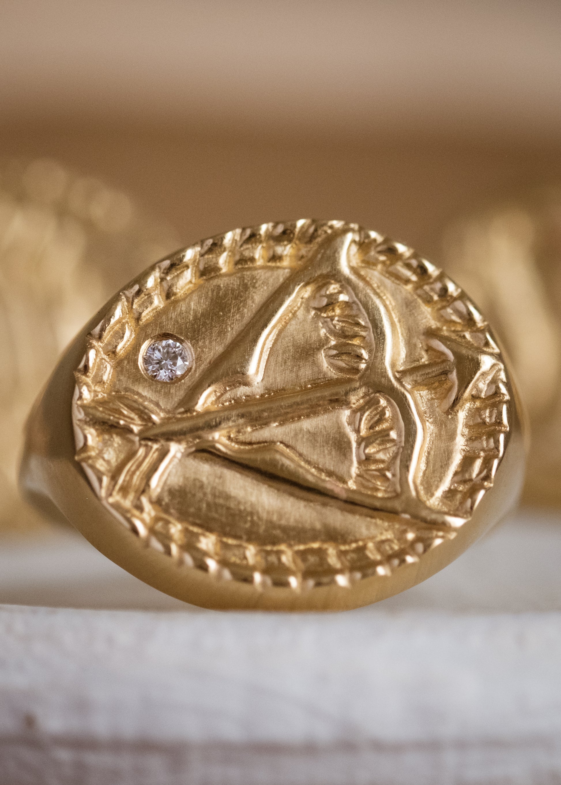 The ninth sign of the Zodiac, fire sign Sagittarius is a passionate traveler whose natural curiosity ignites their adventures. A hand-detailed bow and arrow is accented with a precious diamond for a ring that captures the power of the celestial sky.