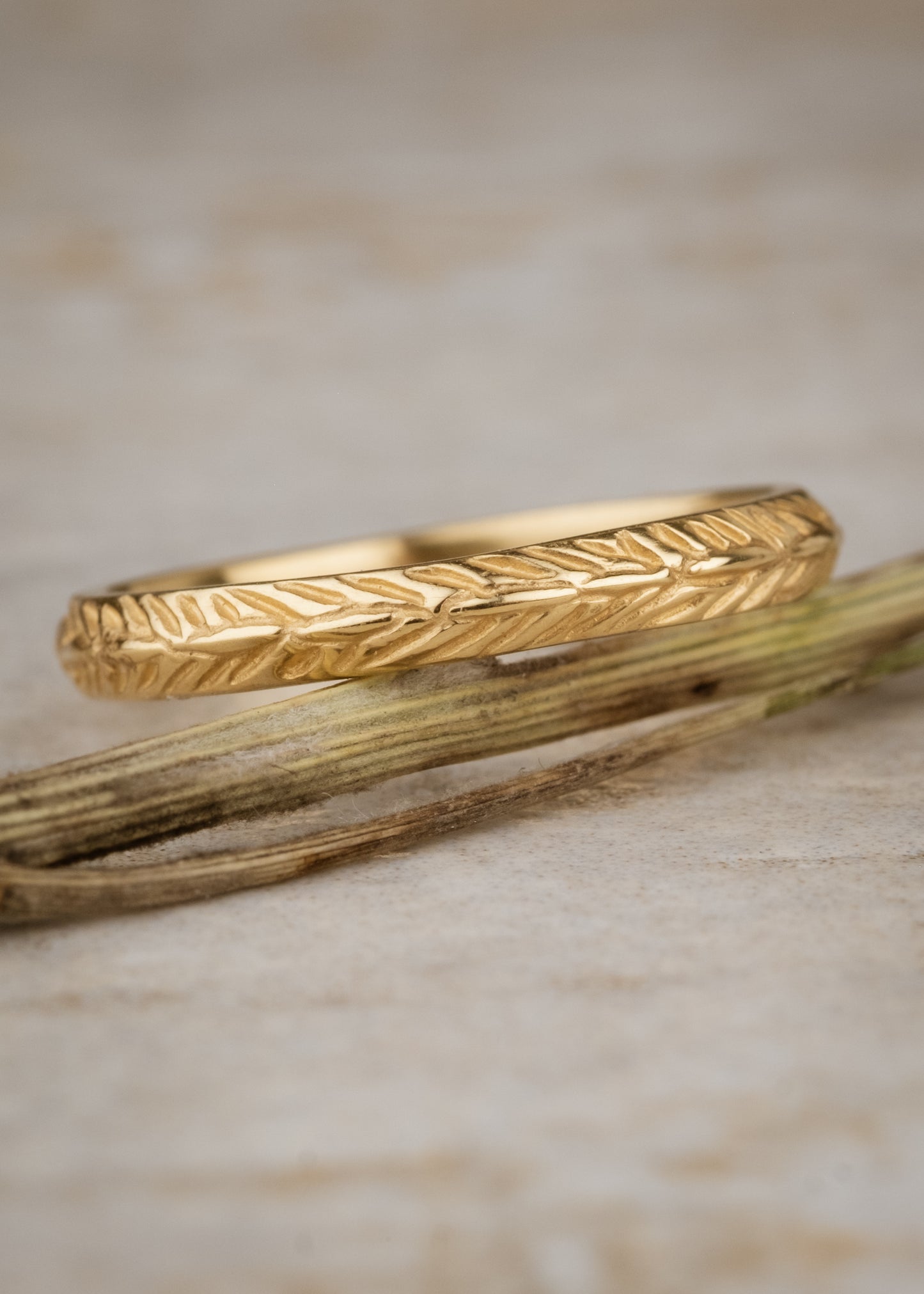 Named for a woman of strength, the Thia ring is detailed with elongated beads balanced on either side by simple v-shaped etchings that mimic a feather—weightless, yet capable of unimaginable feats.