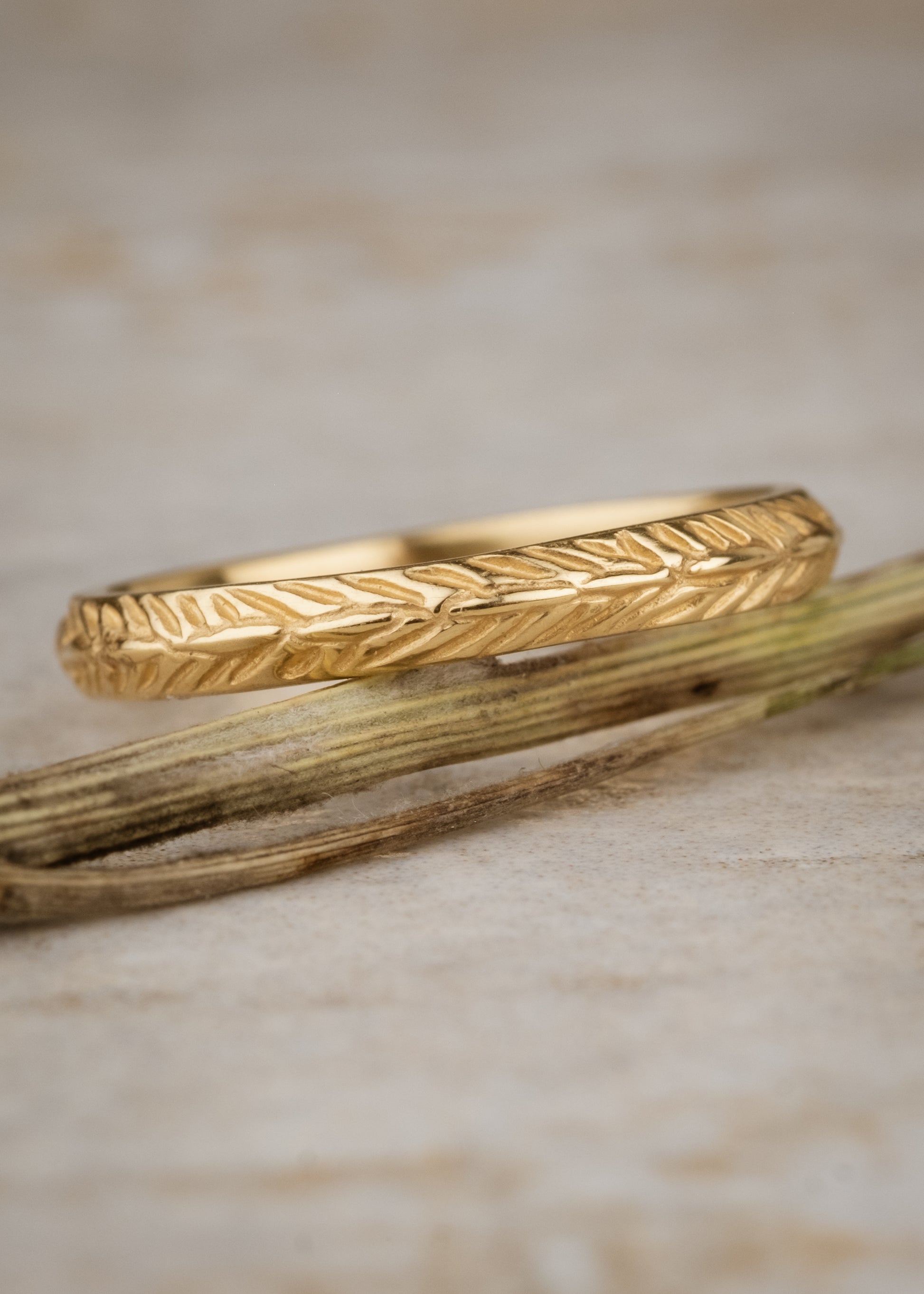 Named for a woman of strength, the Thia ring is detailed with elongated beads balanced on either side by simple v-shaped etchings that mimic a feather—weightless, yet capable of unimaginable feats.