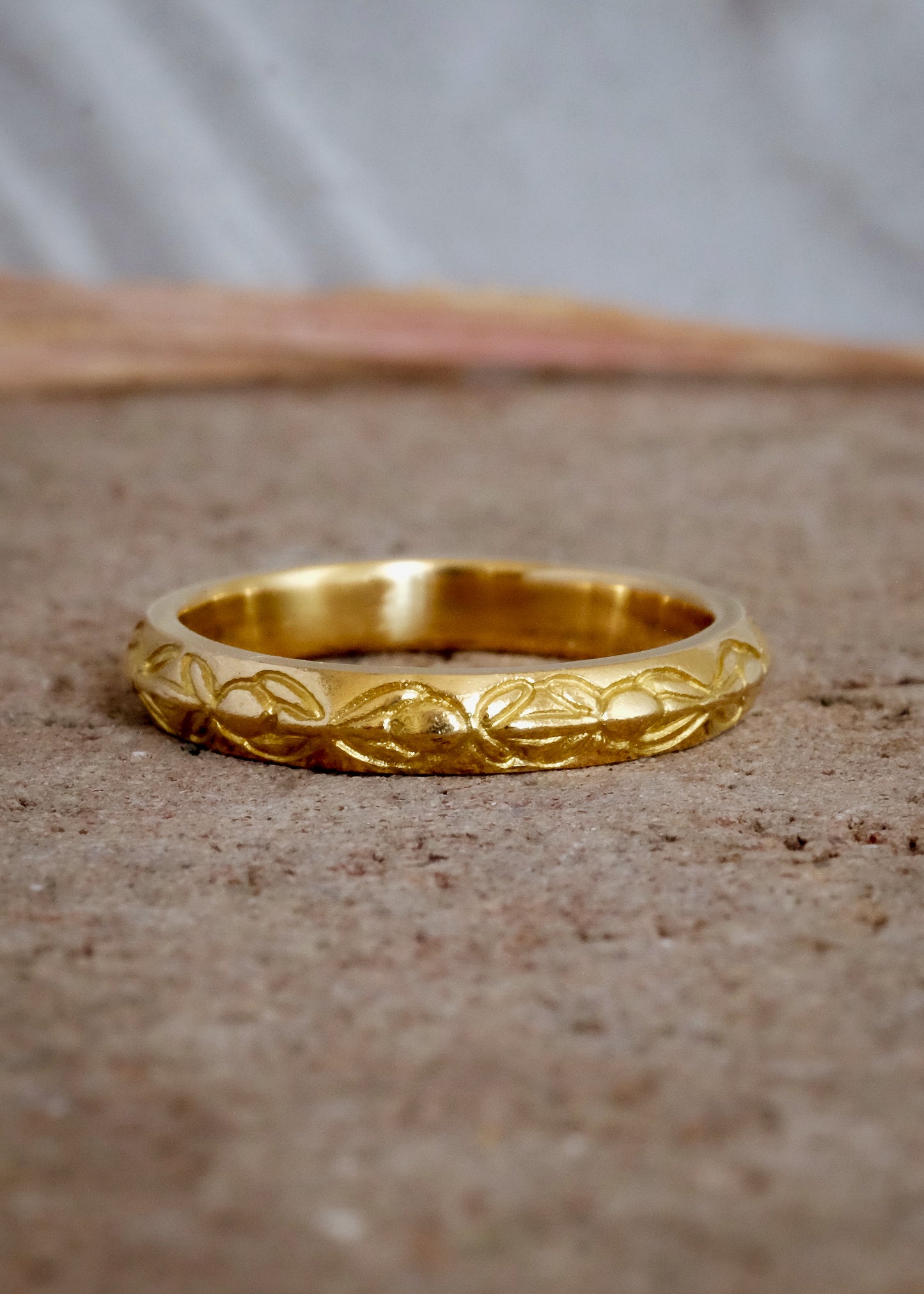 Inspired by the Aramiac word for “twin,” the Tomi ring was originally designed for a customer who requested two bands that shared deep similarities, yet claimed their own unique beauty. Hand-carved beads are connected with gently sloping lines, creating a pattern reminiscent of a delicate chain of flowers.