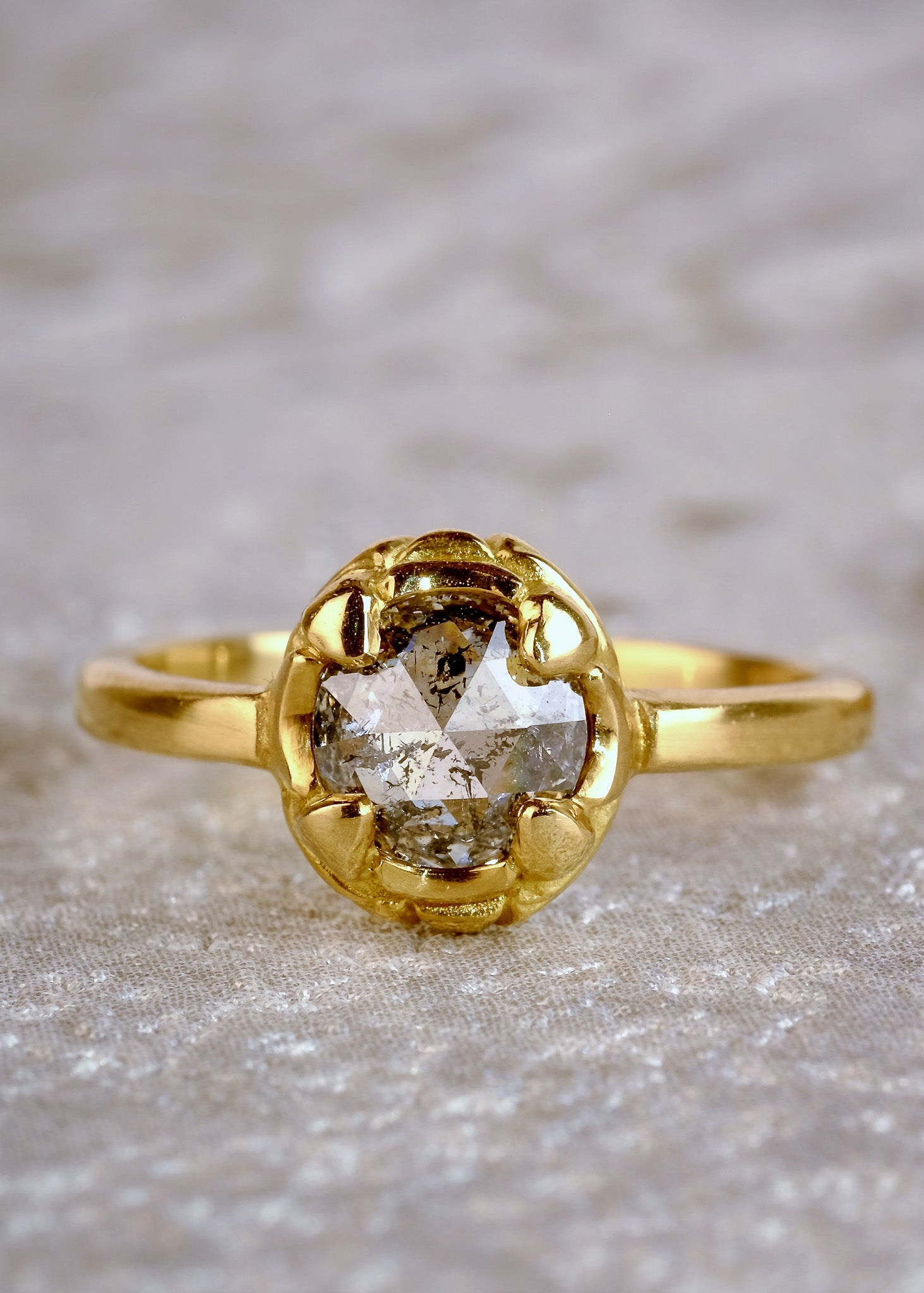Named for Empress Josephine, this ring pairs perfectly with the Empress nesting band. Still stunning on its own, this ring features a rose cut diamond set securely within four prongs— a minimalist setting that marries a modern aesthetic with echoes of the past.