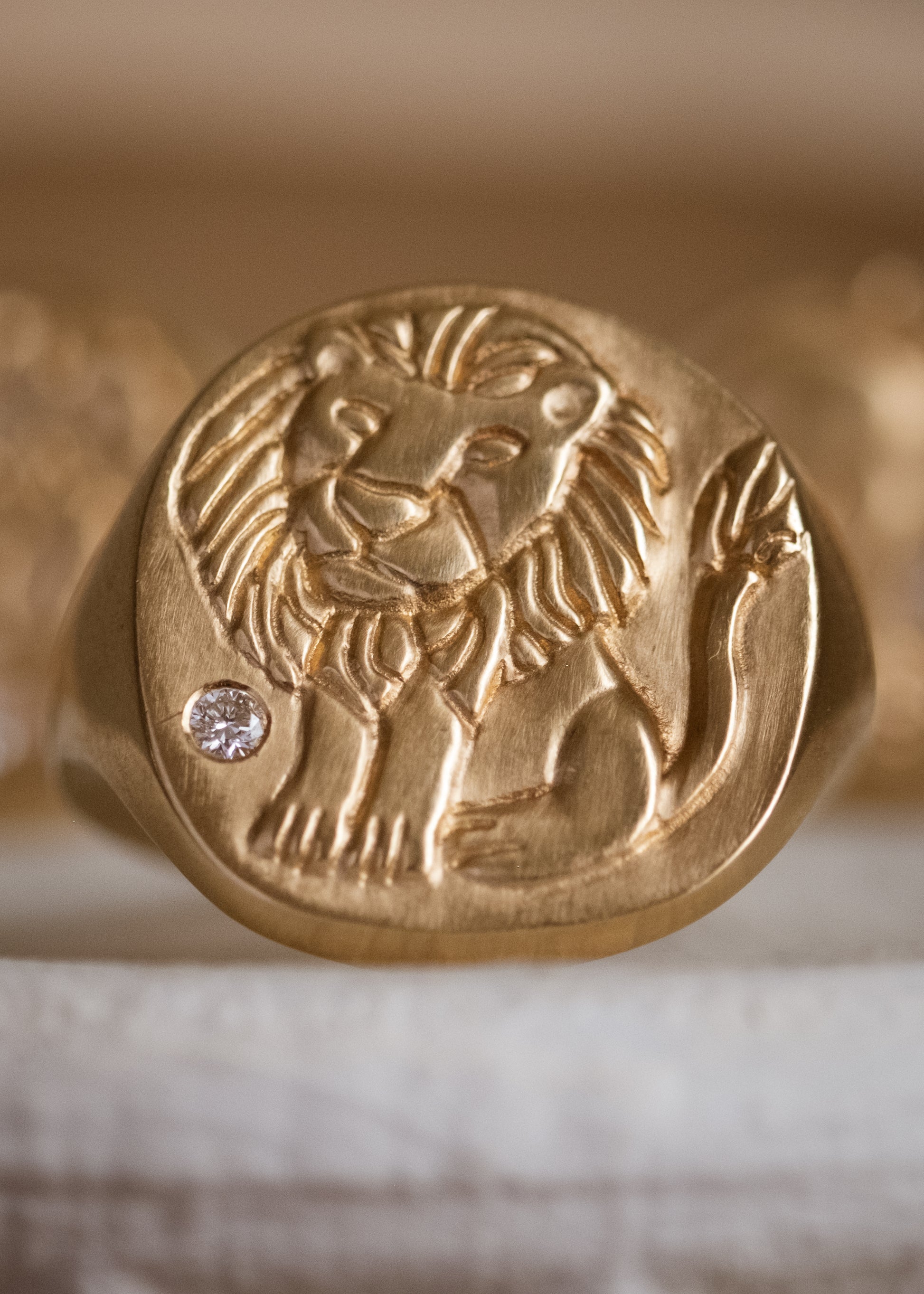 The fifth sign of the Zodiac, fire sign Leo is a natural leader, strong and creative in their approach to the world. A hand-carved, whimsical yet mighty little lion is accented with a precious diamond for a ring that captures the power of the celestial sky.