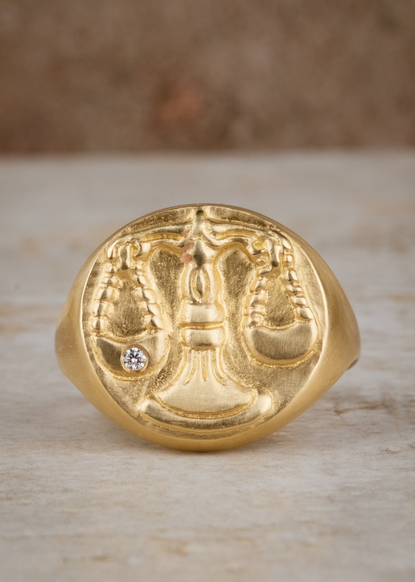 The seventh sign of the Zodiac, air sign Libra is an egalitarian peacemaker in search of harmony. Hand-carved scales of justice grace this pendant, creating a necklace that captures the power of the celestial sky.
