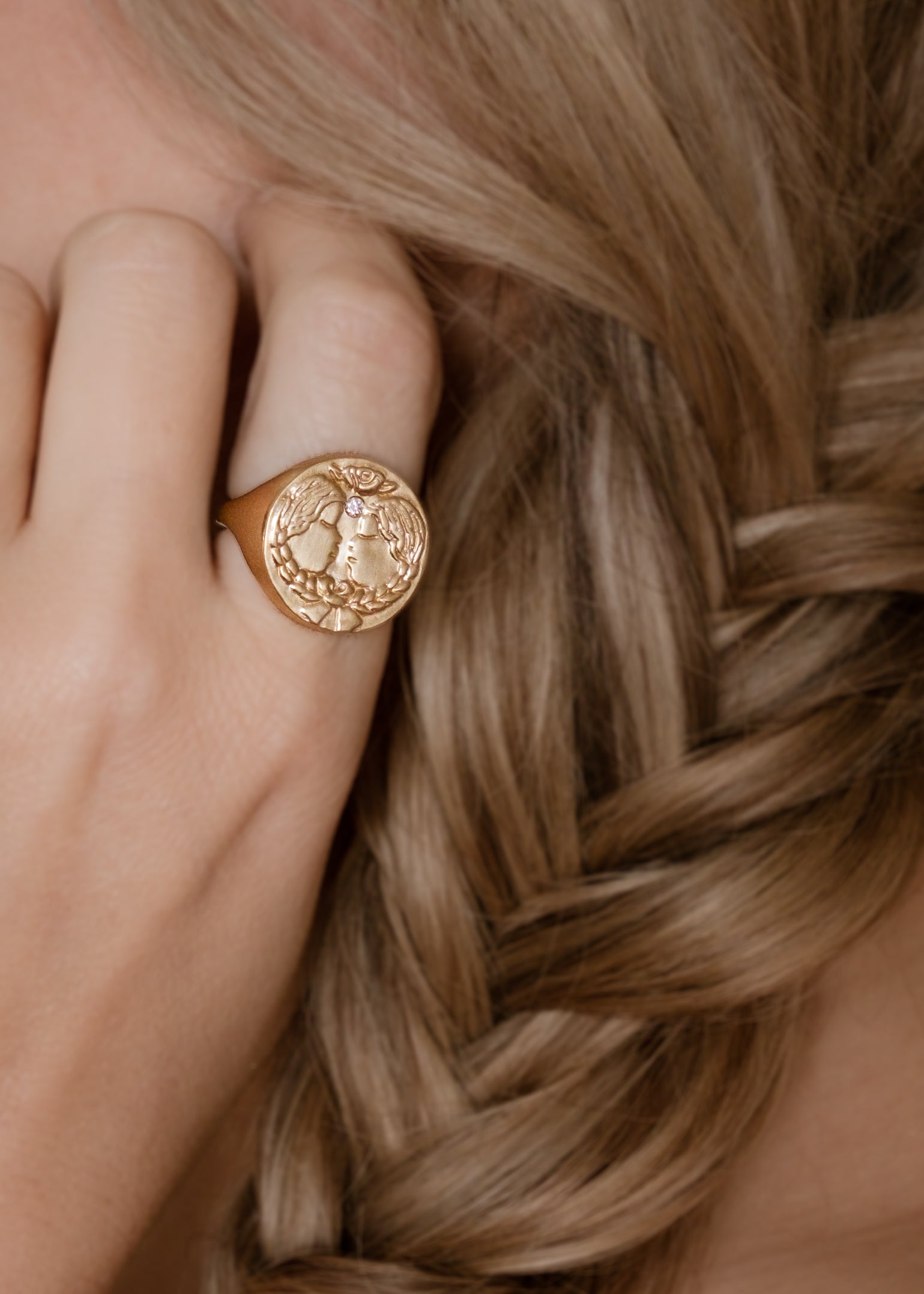 The third sign of the Zodiac, air sign Gemini is quick-witted and curious, with a dual personality that reflects an open mind. Hand-carved twins bound together by a ribbon are accented with a precious diamond for a ring that captures the power of the celestial sky.