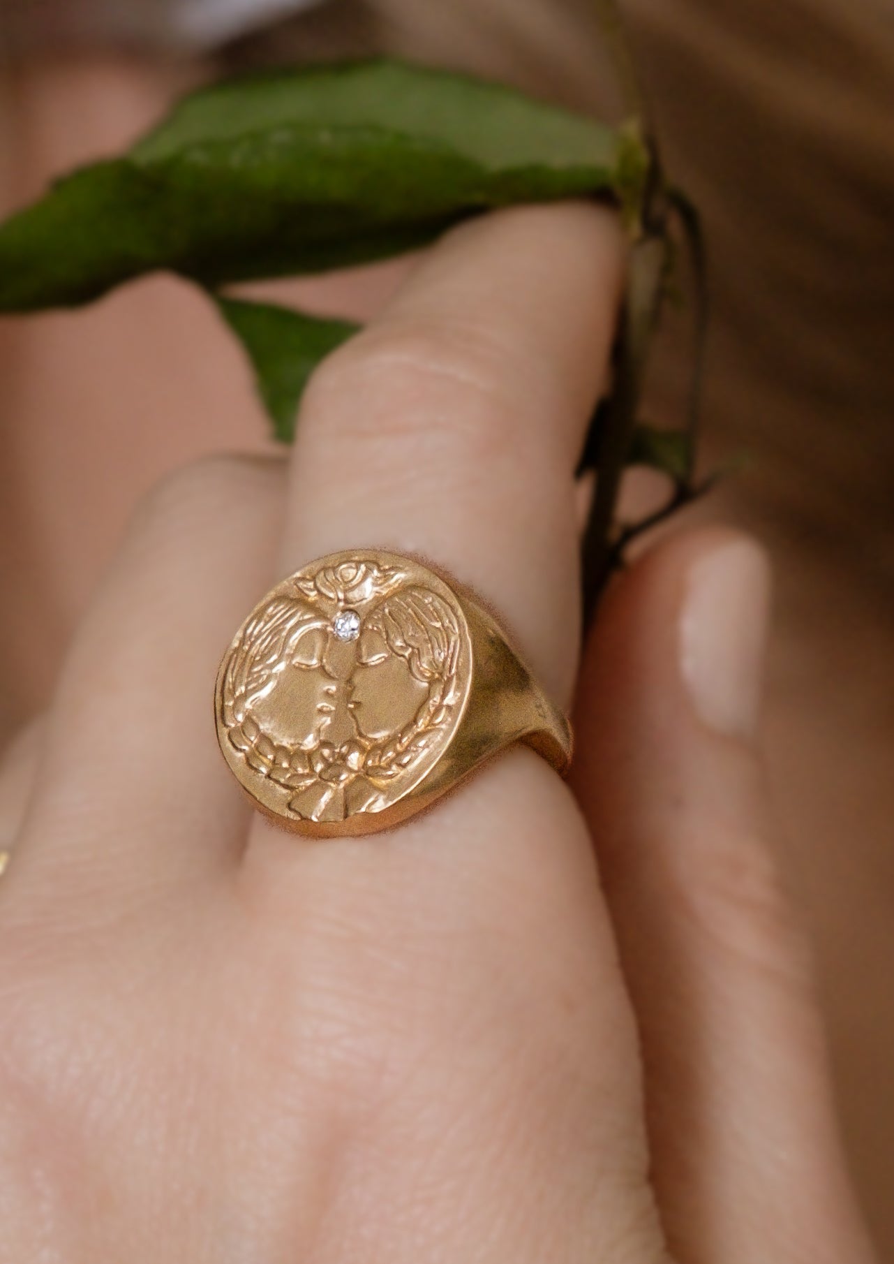 The third sign of the Zodiac, air sign Gemini is quick-witted and curious, with a dual personality that reflects an open mind. Hand-carved twins bound together by a ribbon are accented with a precious diamond for a ring that captures the power of the celestial sky.
