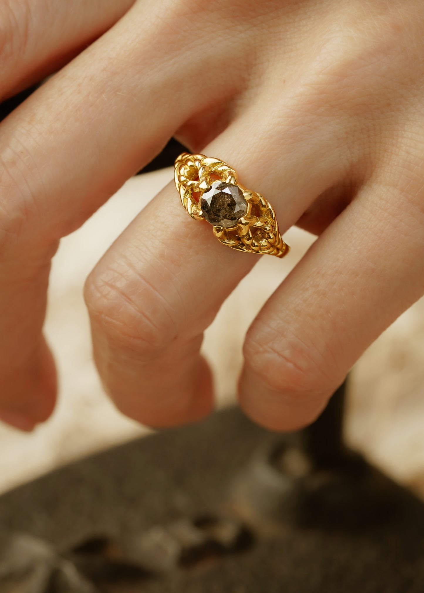 Featuring hand-carved gold that twists and turns to create a rope-like look, the Twine ring holds a stunning rose cut diamond— a piece that embodies strength, grace and beauty.