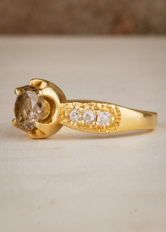 Inspired by the mesmerizing solo by musician Maxence Cyrin, the Gradiva ring embodies both the resonant chords and whimsical trills of the piano in a piece that marries substance with ethereal beauty. Brilliant inlaid diamonds adorn the band of the ring as a precious fancy diamond sits prominently within the gold prongs—an heirloom-worthy ring to be cherished for generations.