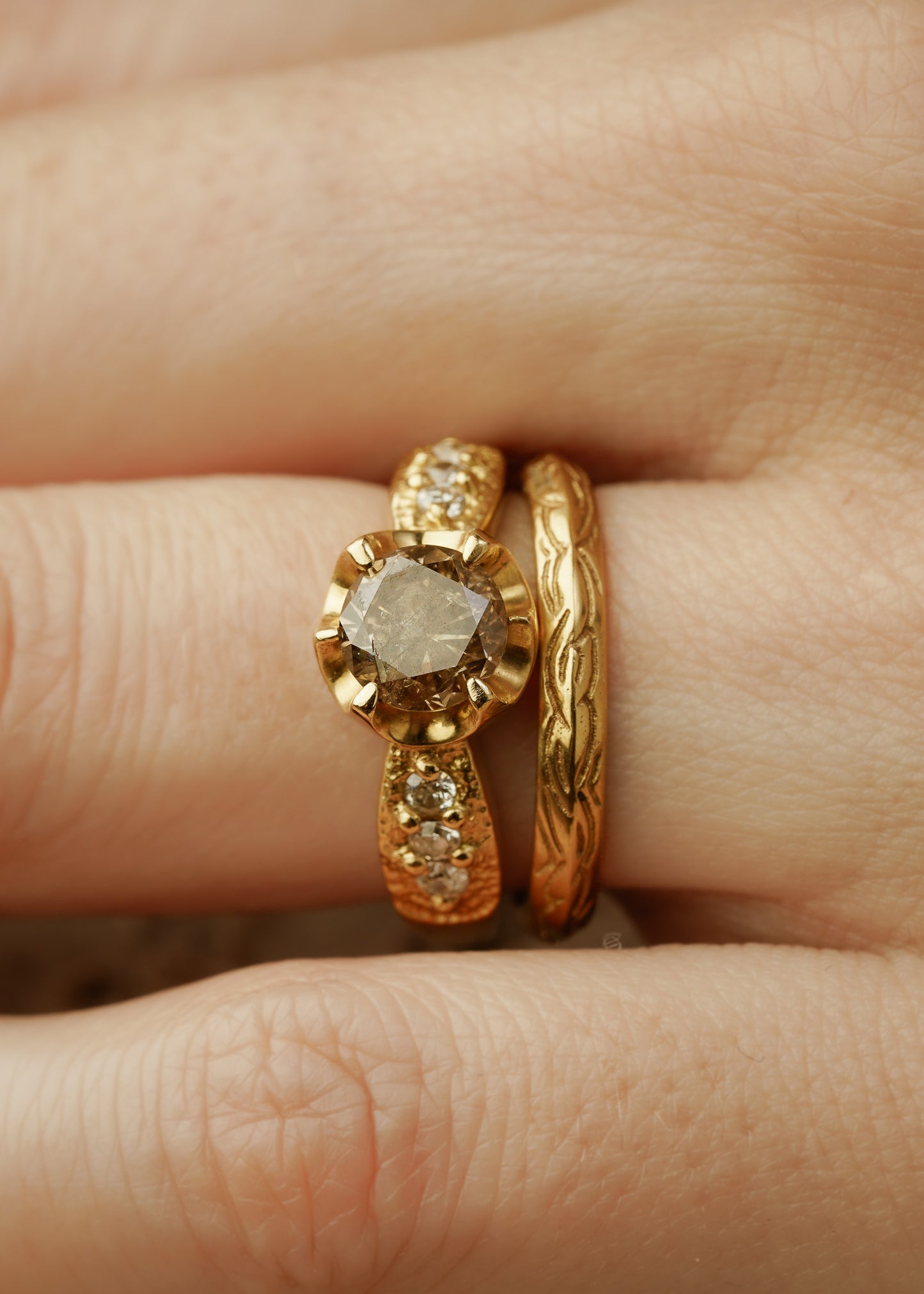 Beyond the creaking floorboards of the antique shop stands a curio cabinet, a sentinel of small treasures redolent with tales of love and lore. Inspired by these cabinets that hold such rare objects, the Curio necklace shines with a stunning oval tourmaline. A rose cut diamond hovers above, a shining crown punctuated by delicate hand-carved gold beads–a necklace worthy of telling your story for generations to come.