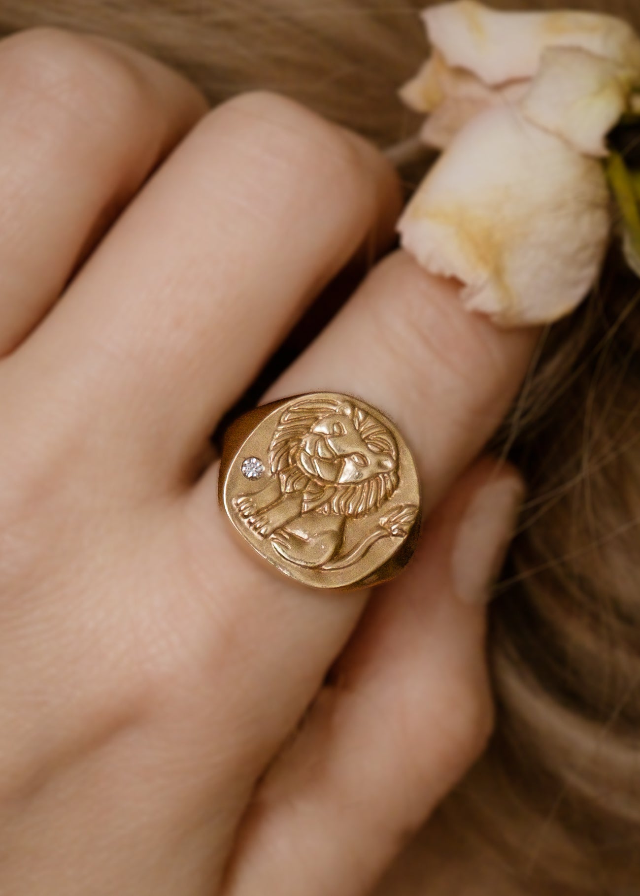 The fifth sign of the Zodiac, fire sign Leo is a natural leader, strong and creative in their approach to the world. A hand-carved, whimsical yet mighty little lion is accented with a precious diamond for a ring that captures the power of the celestial sky.