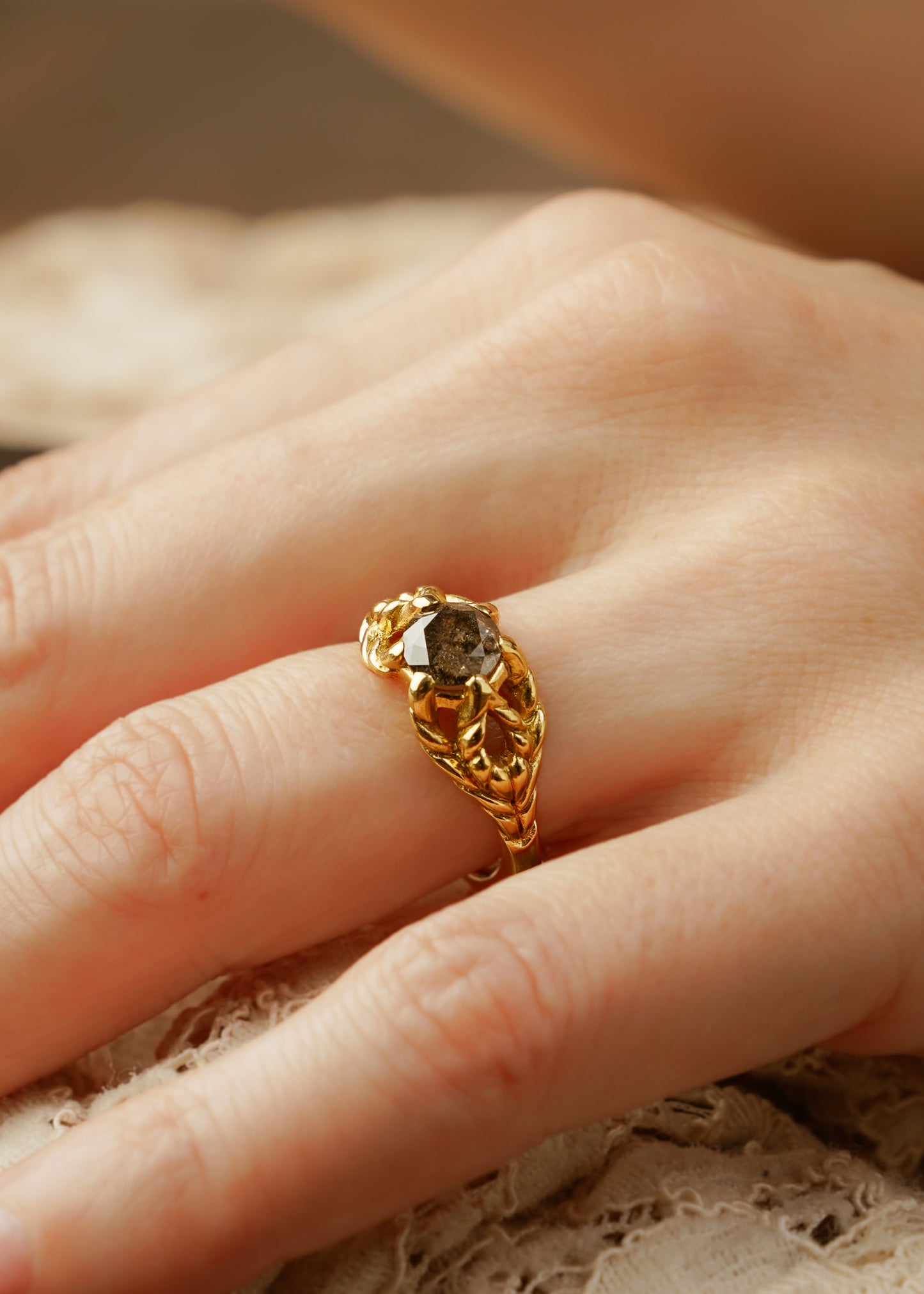 Featuring hand-carved gold that twists and turns to create a rope-like look, the Twine ring holds a stunning rose cut diamond— a piece that embodies strength, grace and beauty.
