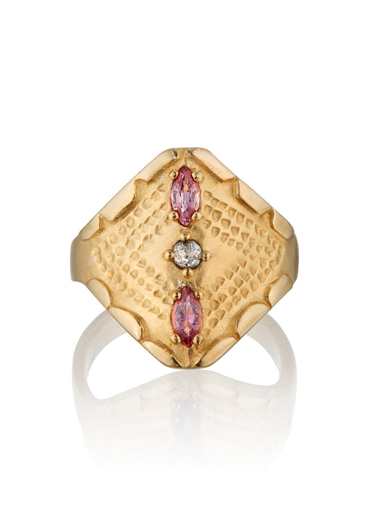 Inspired by the pointed arches in ancient cathedrals, the Radial ring marries the strength of this architectural element with the softness of the hand-carved scalloped detail along the edges. Tourmalines and a rose cut diamond align in the center of this statement ring, radiating their light along an intricate textured pattern that highlights the beauty of the gold.